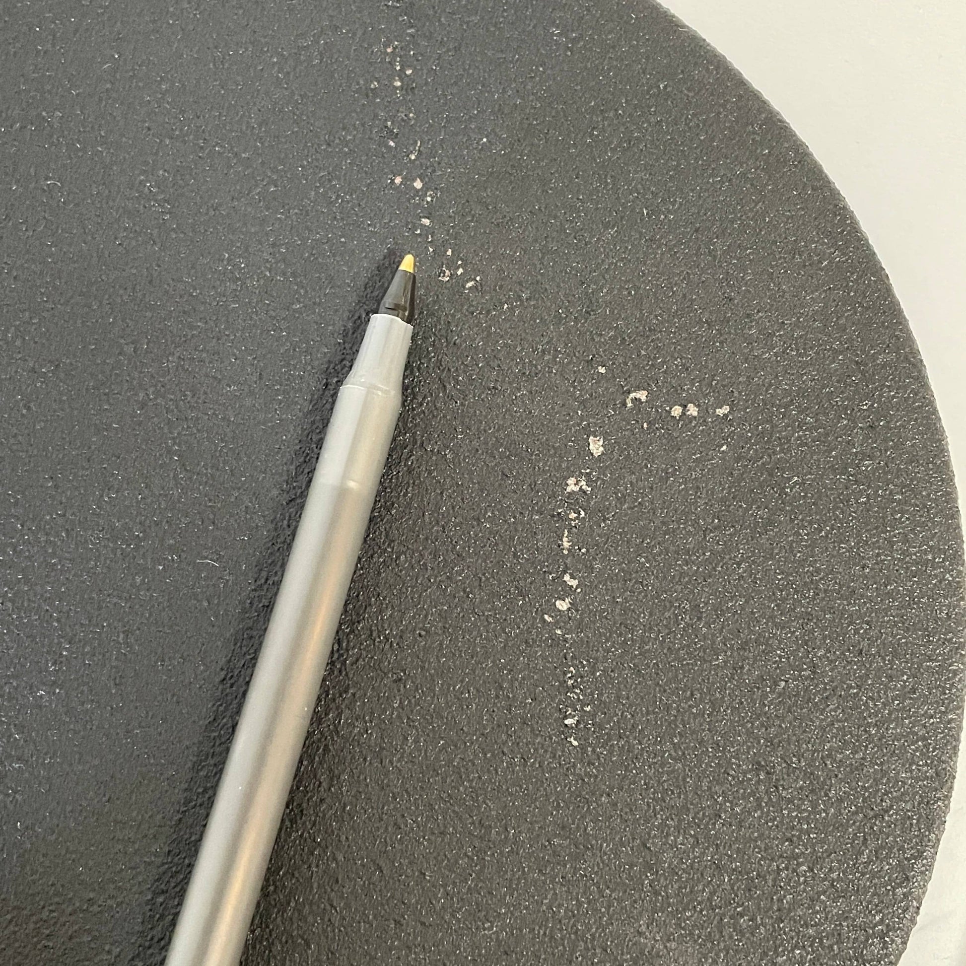 A Fontana Arte Chrono Task Lamp with a black shade and white background.