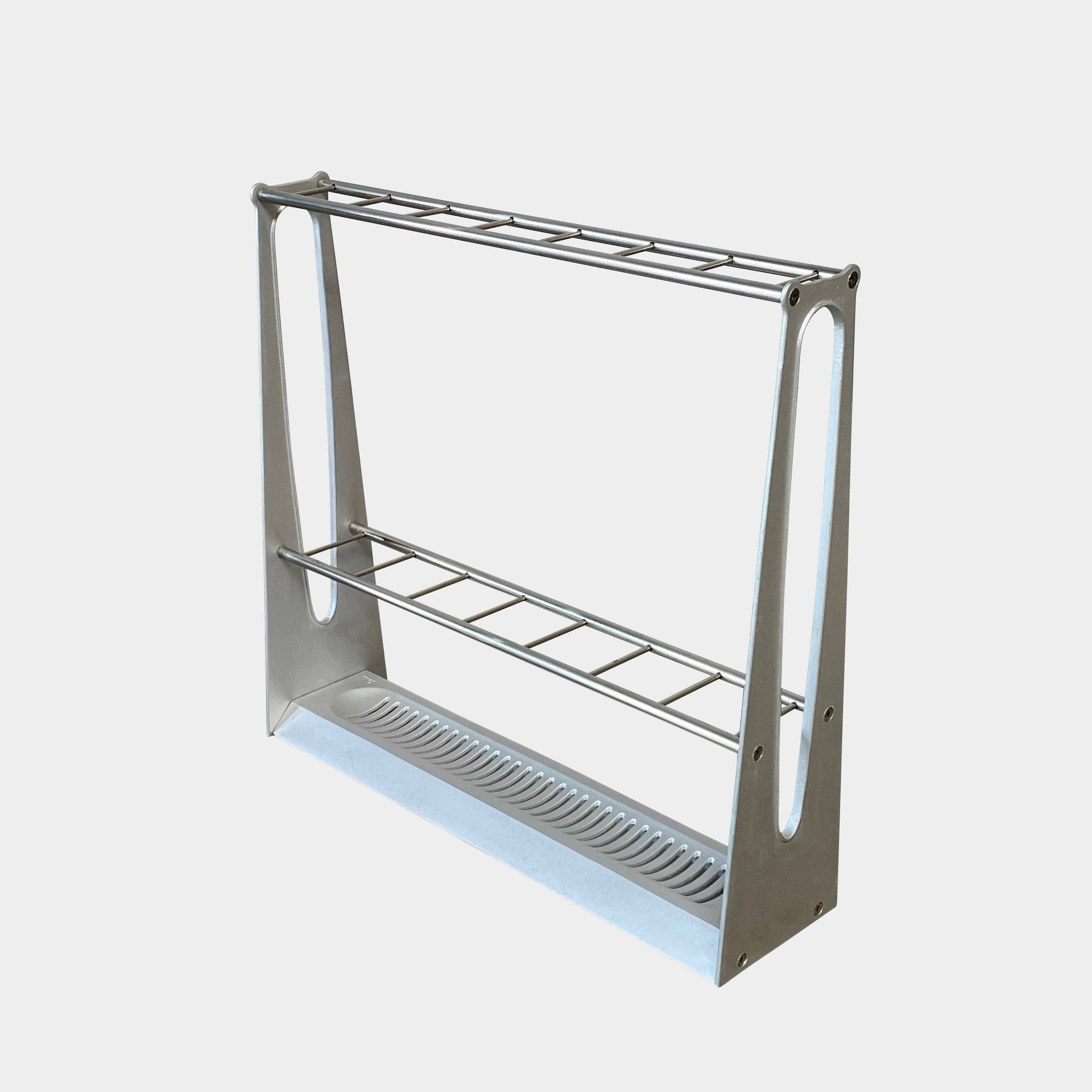 A BD Barcelona Barcelonés Umbrella Stand with two shelves on it awarded by Adi-Fad Delta Award.