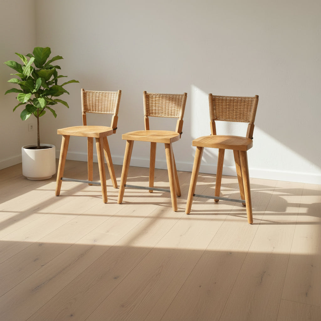 The Furniture Marolles Counter Stool Set of 3 by Furniture Marolles, featuring wooden construction and woven backrests inspired by handcrafted design, is arranged side by side against a plain white background.