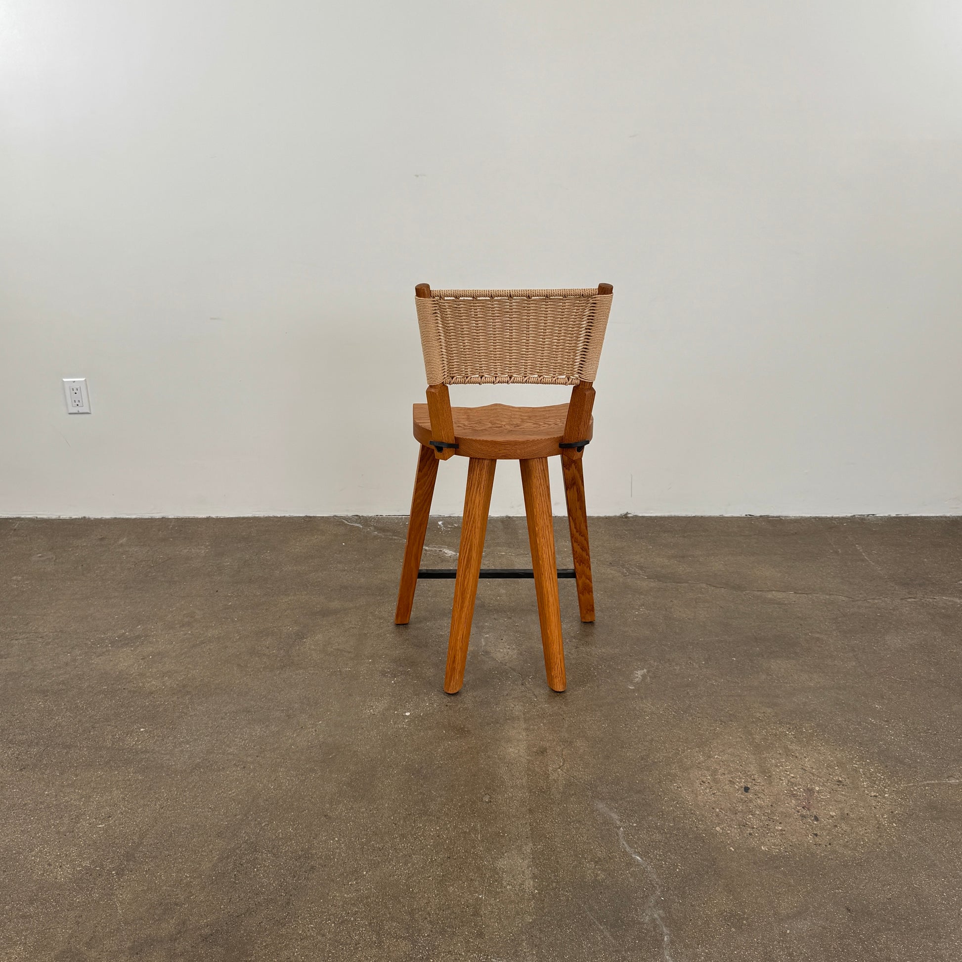 The Furniture Marolles Counter Stool Set of 3 by Furniture Marolles, featuring wooden construction and woven backrests inspired by handcrafted design, is arranged side by side against a plain white background.