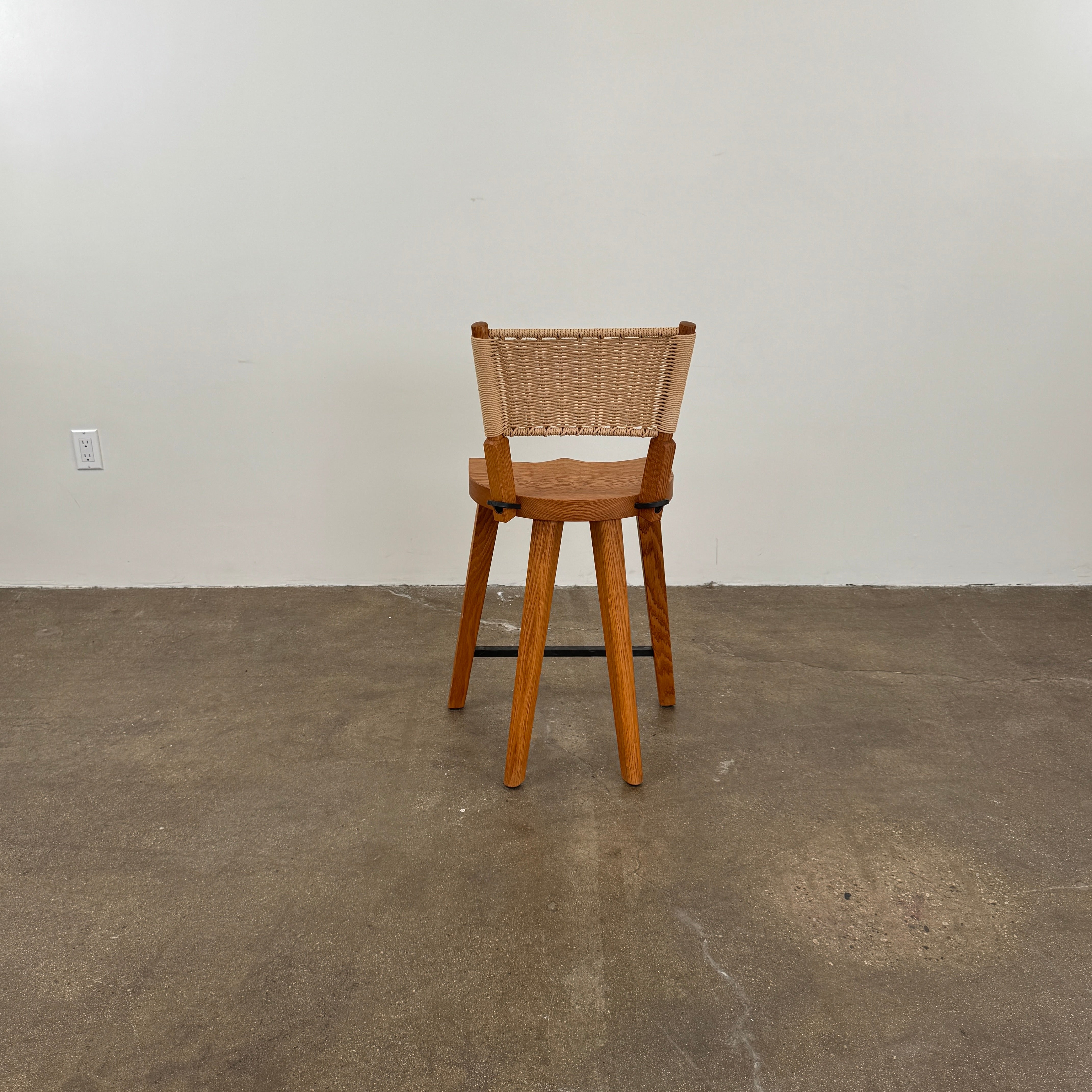 The Furniture Marolles Counter Stool Set of 3 by Furniture Marolles, featuring wooden construction and woven backrests inspired by handcrafted design, is arranged side by side against a plain white background.
