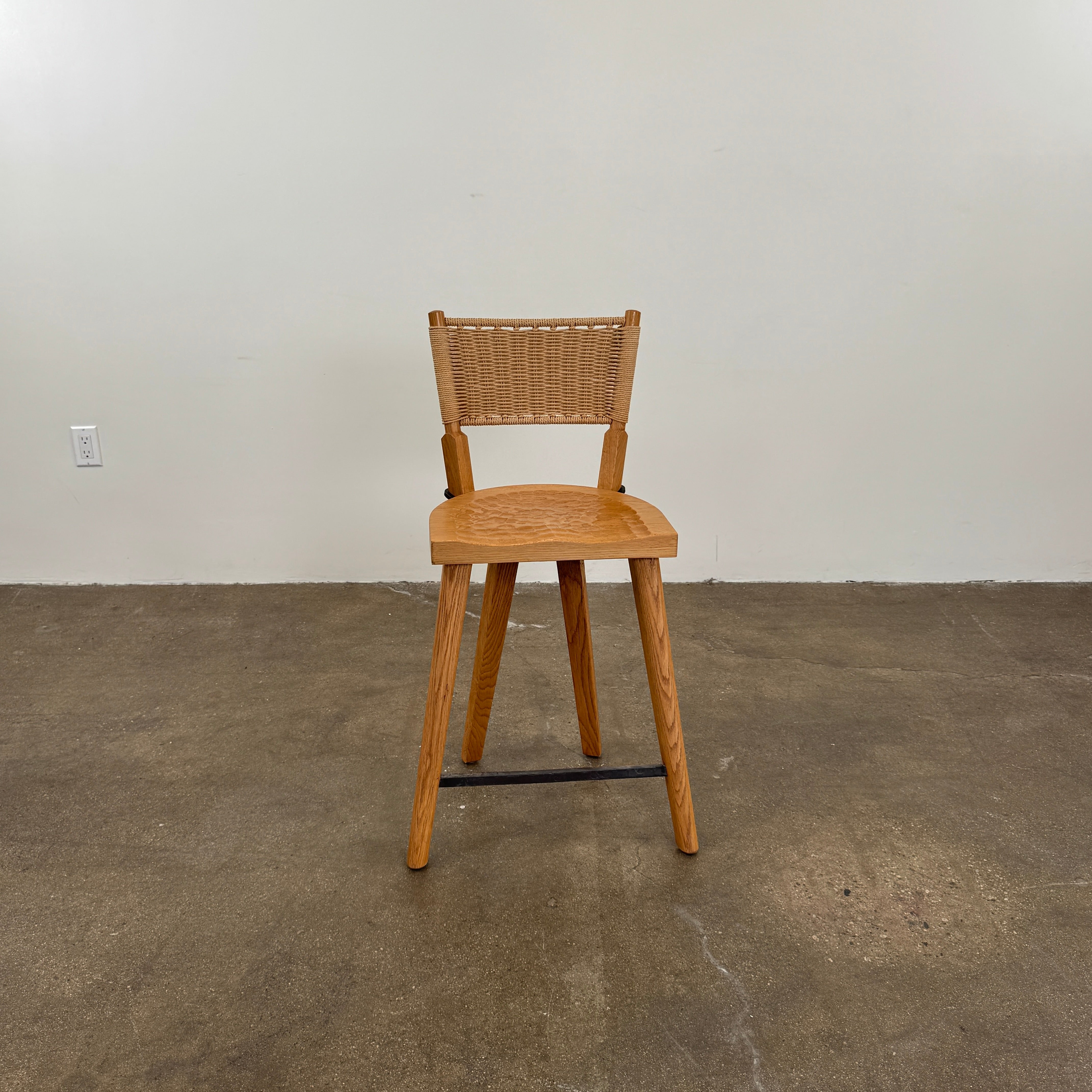 The Furniture Marolles Counter Stool Set of 3 by Furniture Marolles, featuring wooden construction and woven backrests inspired by handcrafted design, is arranged side by side against a plain white background.