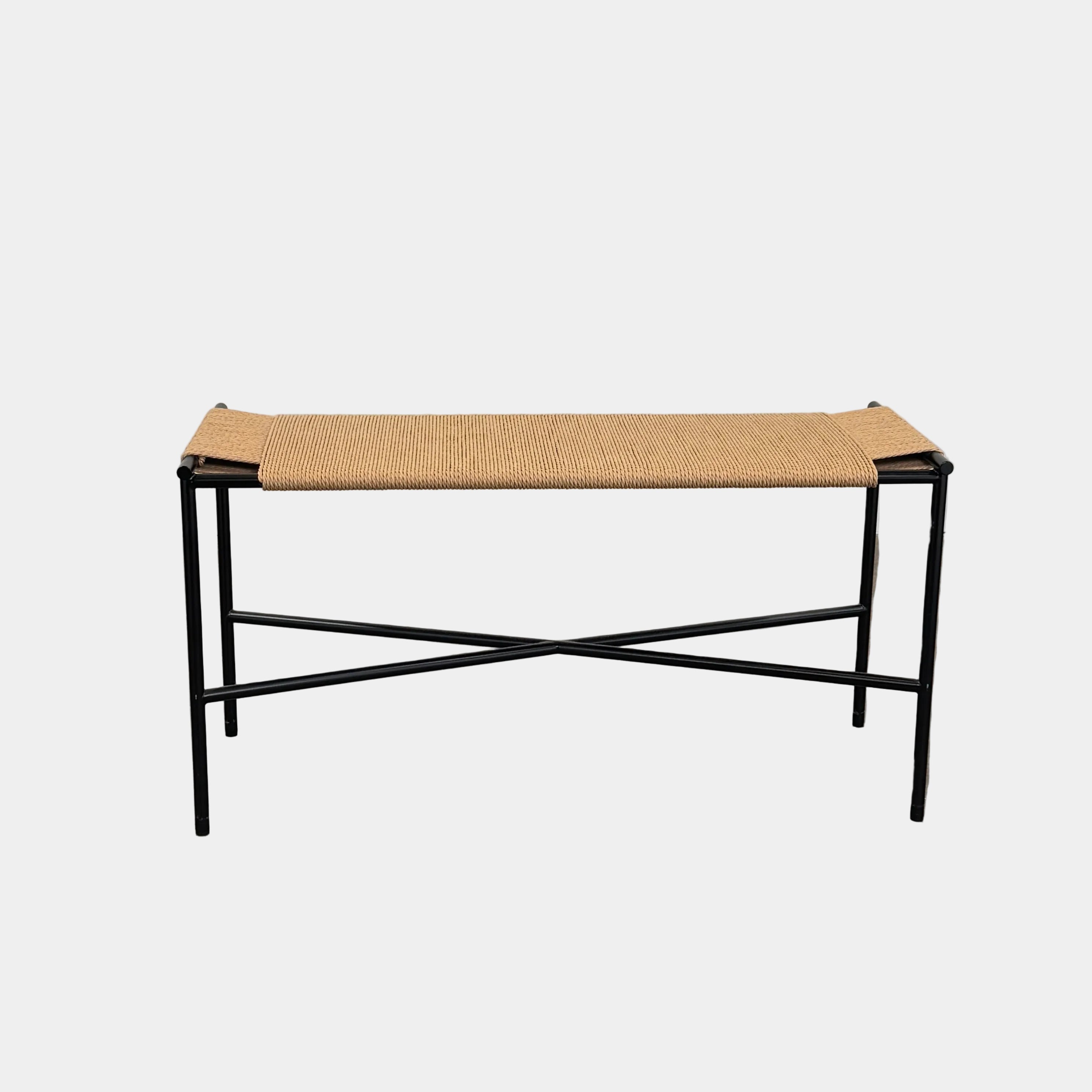 Fritz Hansen Skagerak VENT Bench by Fritz Hansen, featuring a rectangular black metal frame with minimalist crossed supports underneath and a woven tan paper cord seat, shown on a plain white background.