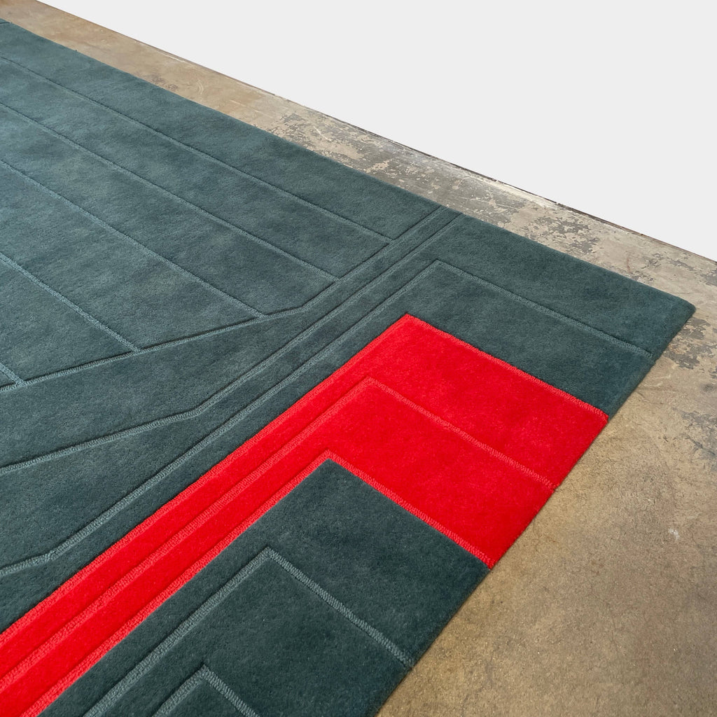A Della Robbia Jay-V Custom Rug with red and blue stripes on it.