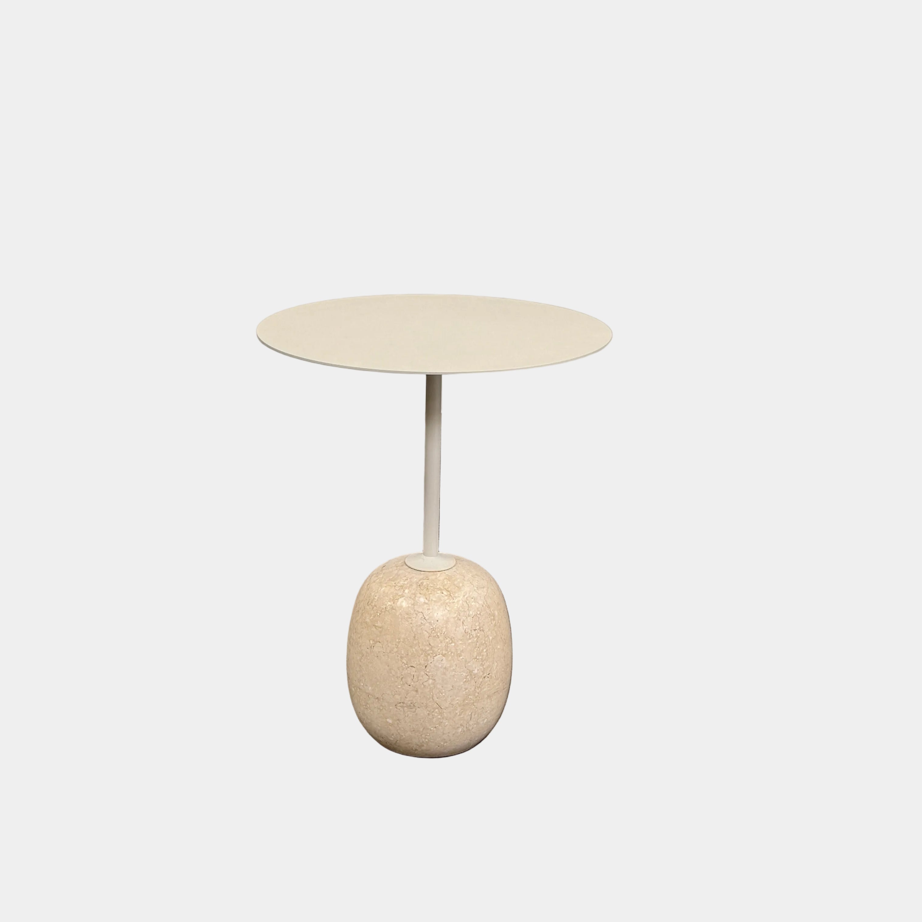 The &Tradition Crema Diva Marble Lato Side Table by &Tradition features a thin, light-colored round top supported by a slender vertical stem and rests on a smooth oval base crafted from Crema Diva marble, all set against a plain white background. Inspired by the iconic Lato Side Table design, this piece combines elegance with timeless style.