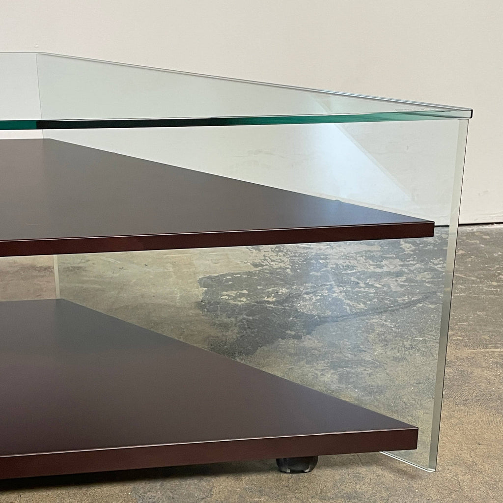 An Artelano Corner Shelf Unit with a glass top and a wooden base.
