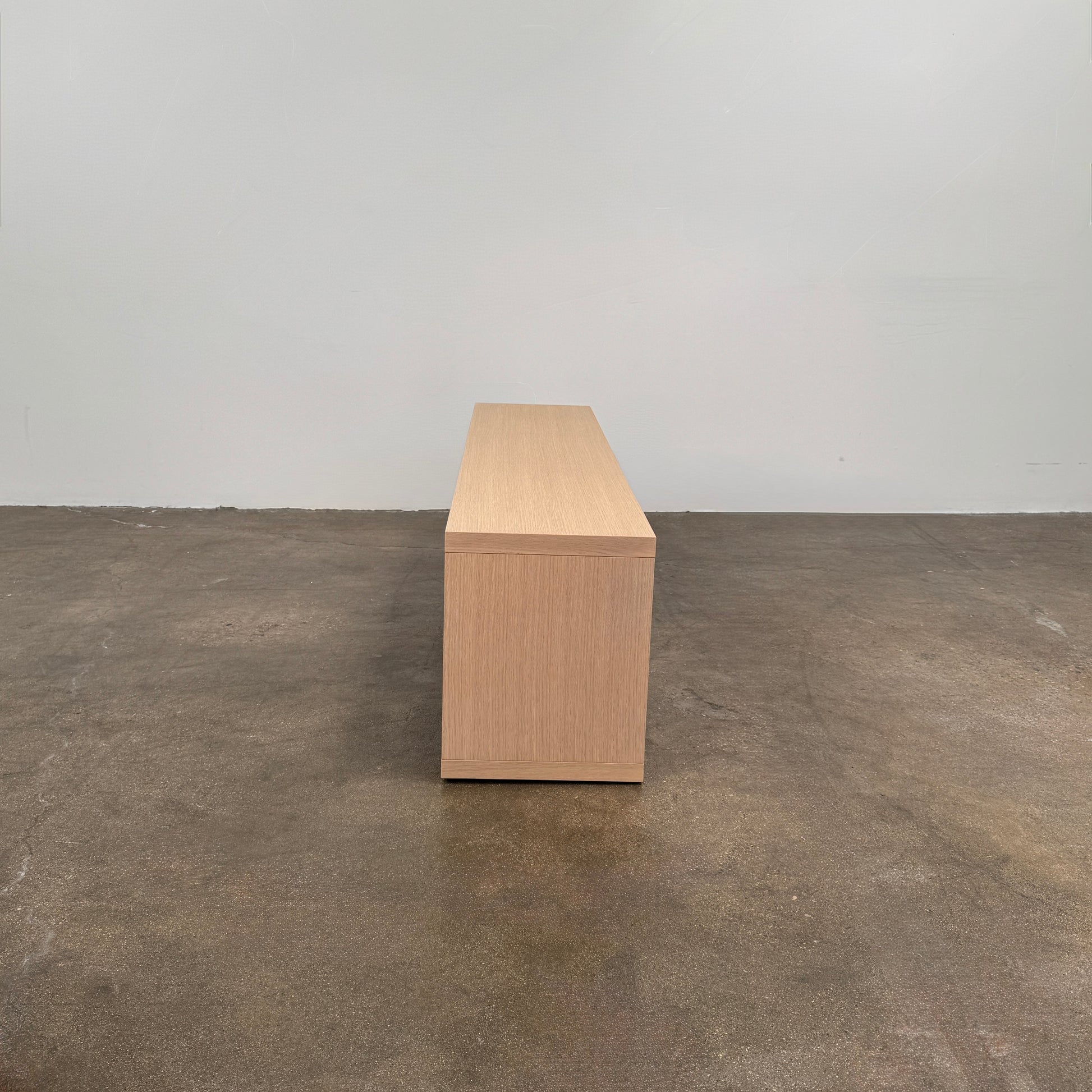 B&B Italia Frank Low Console by B&B Italia, a rectangular wooden shelf with open front and back in a minimalist design, displayed against a plain white background.