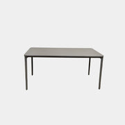 A minimalist rectangular Sovet Slim Extendable Dining Table in gray with four straight legs, designed by Sovet and photographed against a white background.