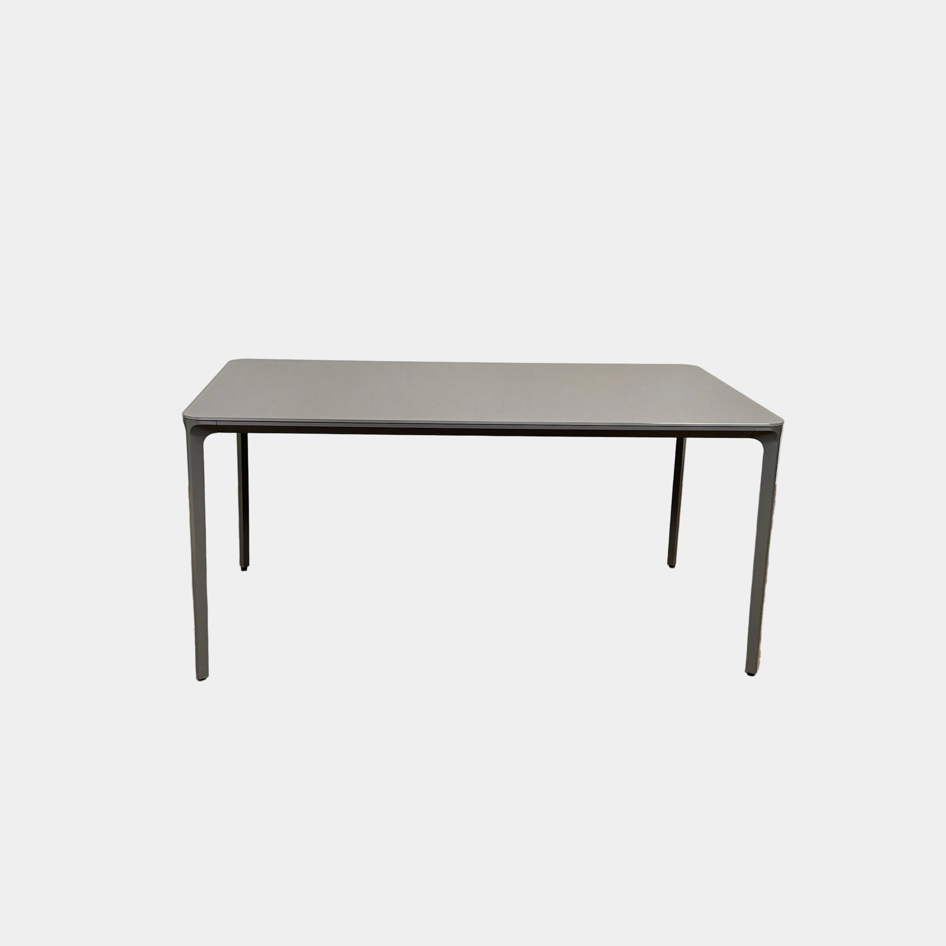 A minimalist rectangular Sovet Slim Extendable Dining Table in gray with four straight legs, designed by Sovet and photographed against a white background.