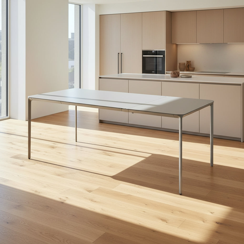 A minimalist rectangular Sovet Slim Extendable Dining Table in gray with four straight legs, designed by Sovet and photographed against a white background.