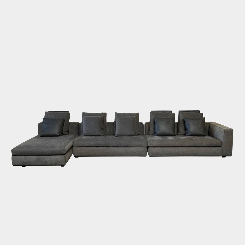A Minotti Powell Sectional Sofa with a comfortable label on it.