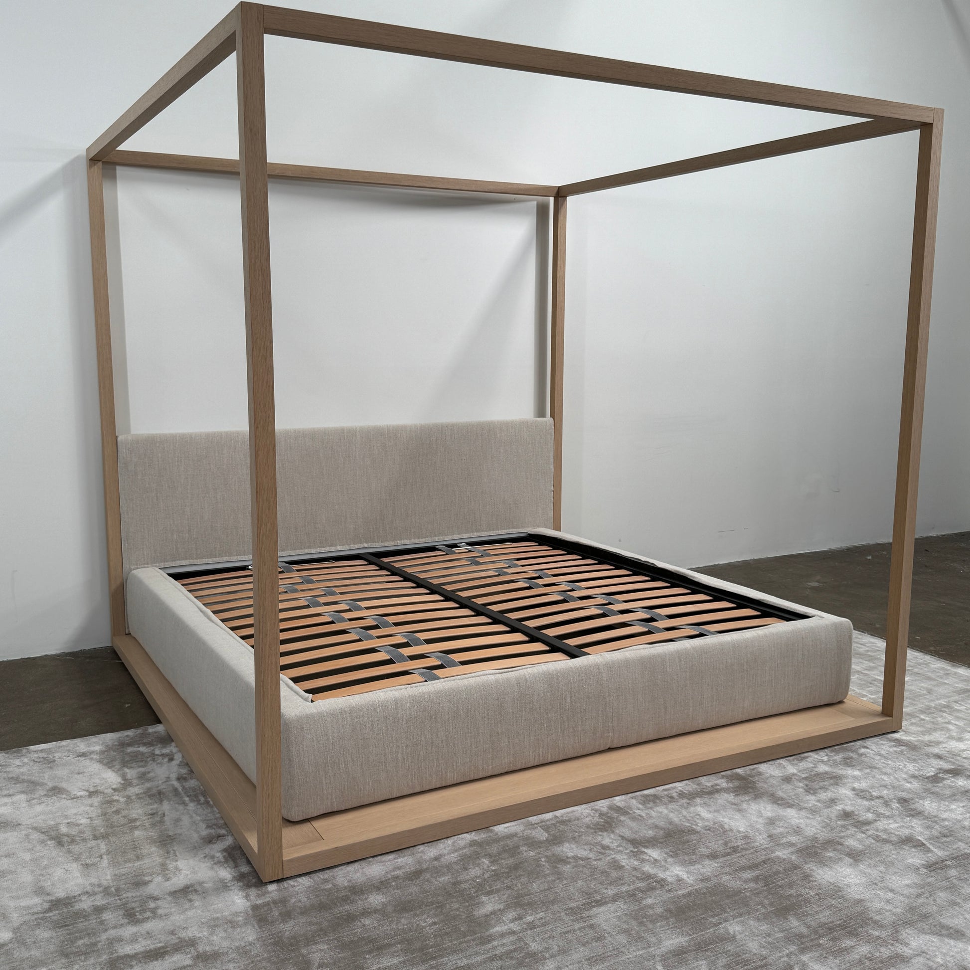 The Maxalto Alcova King Bed with Bench and Nightstands by Maxalto showcases a refined wooden structure, an upholstered headboard, and a slatted mattress base, capturing modern canopy bed design inspired by Antonio Citterio—displayed against a plain white background.