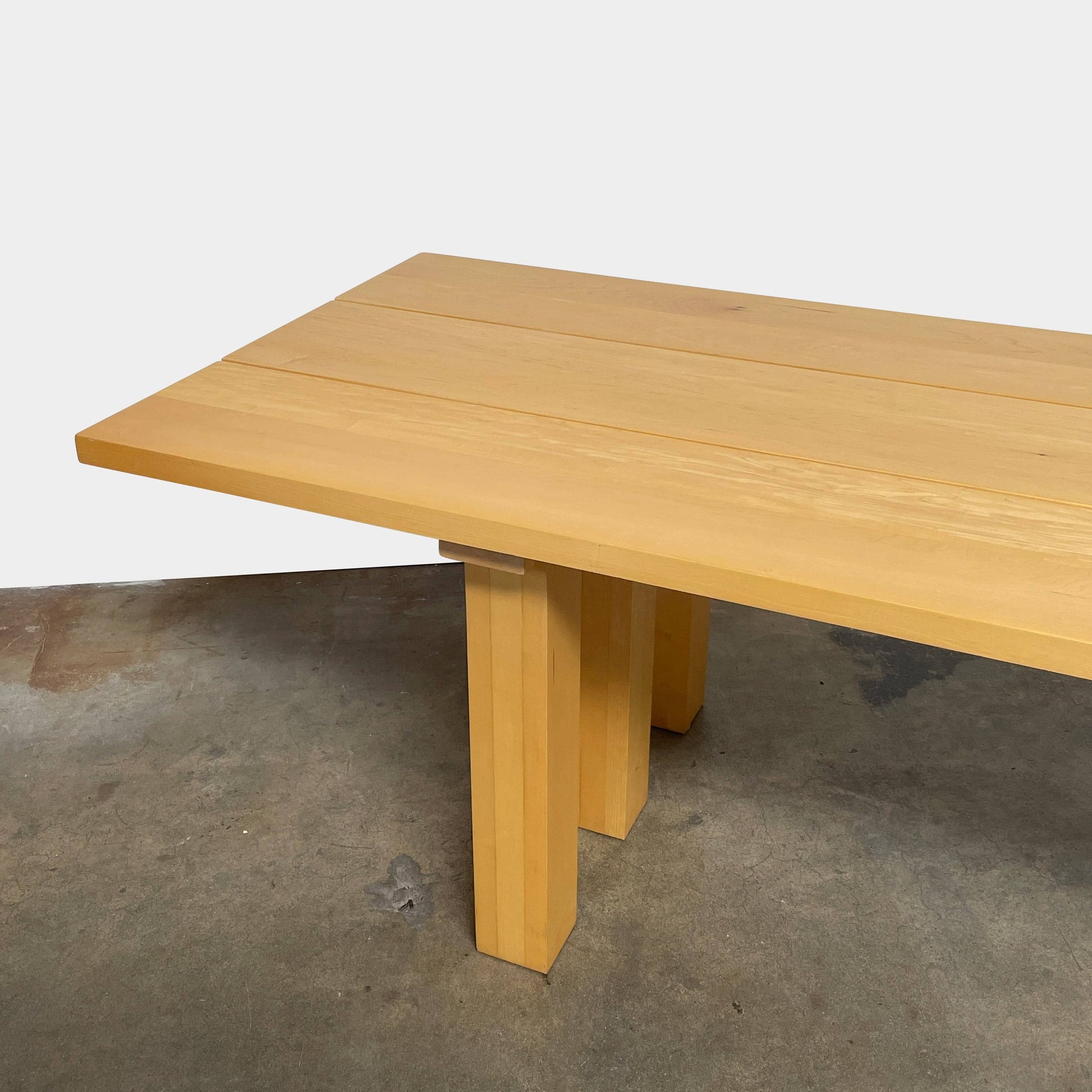 A Vintage Cassina La Basilica Dining Table by Mario Bellini, featuring a wooden rectangular design with a simple aesthetic and four legs, evocative of the iconic architectural style.