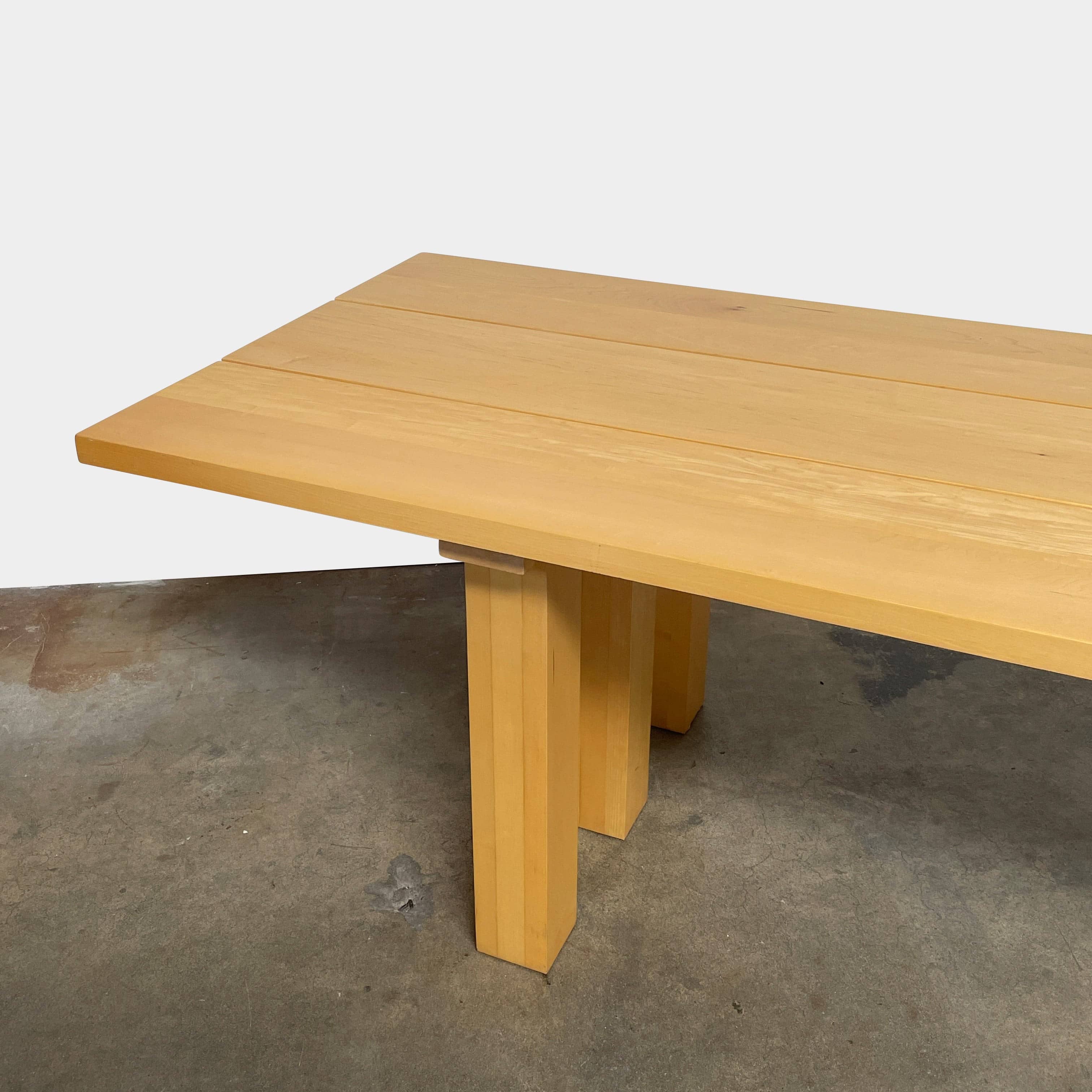 A Vintage Cassina La Basilica Dining Table by Mario Bellini, featuring a wooden rectangular design with a simple aesthetic and four legs, evocative of the iconic architectural style.