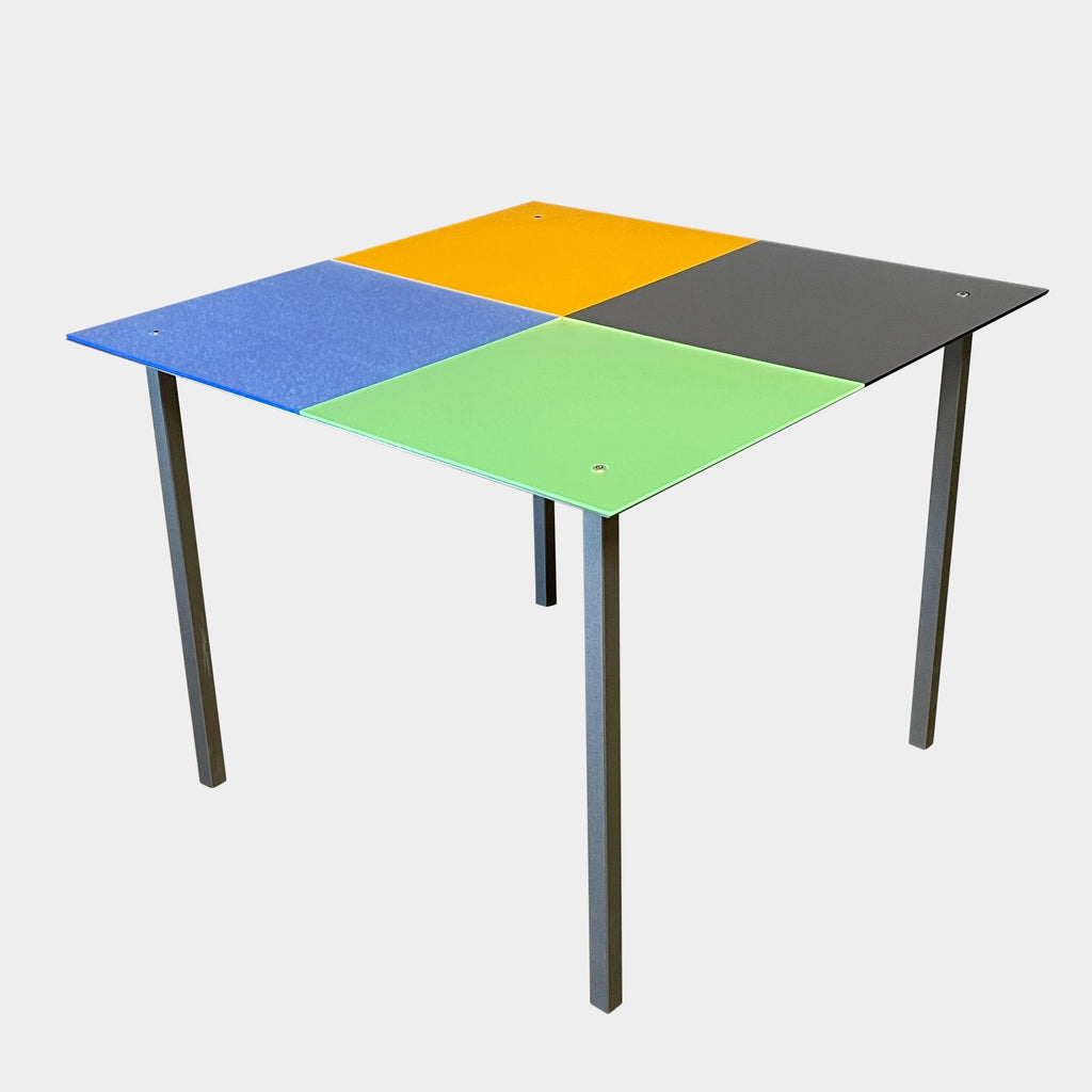 A Mazzei multi-colored square metal table with a metal frame.