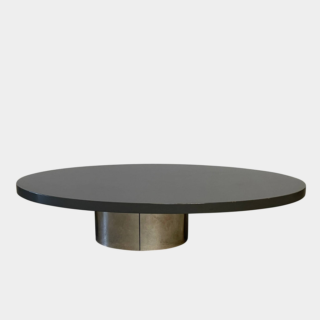 A sleek Minotti Raymond Coffee Table with a metal base, exhibiting clean shapes and proportions.