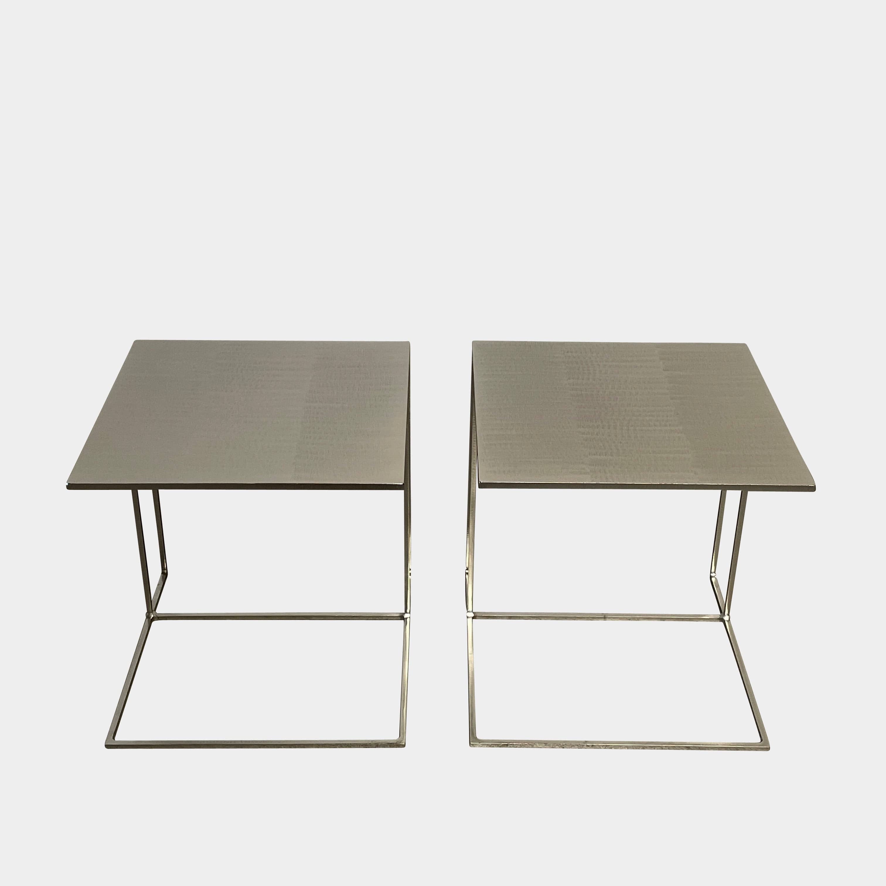 The Minotti Leger Side Table, by Minotti, features a metallic accent with its metal frame, creating a clean and minimal design against a white background.