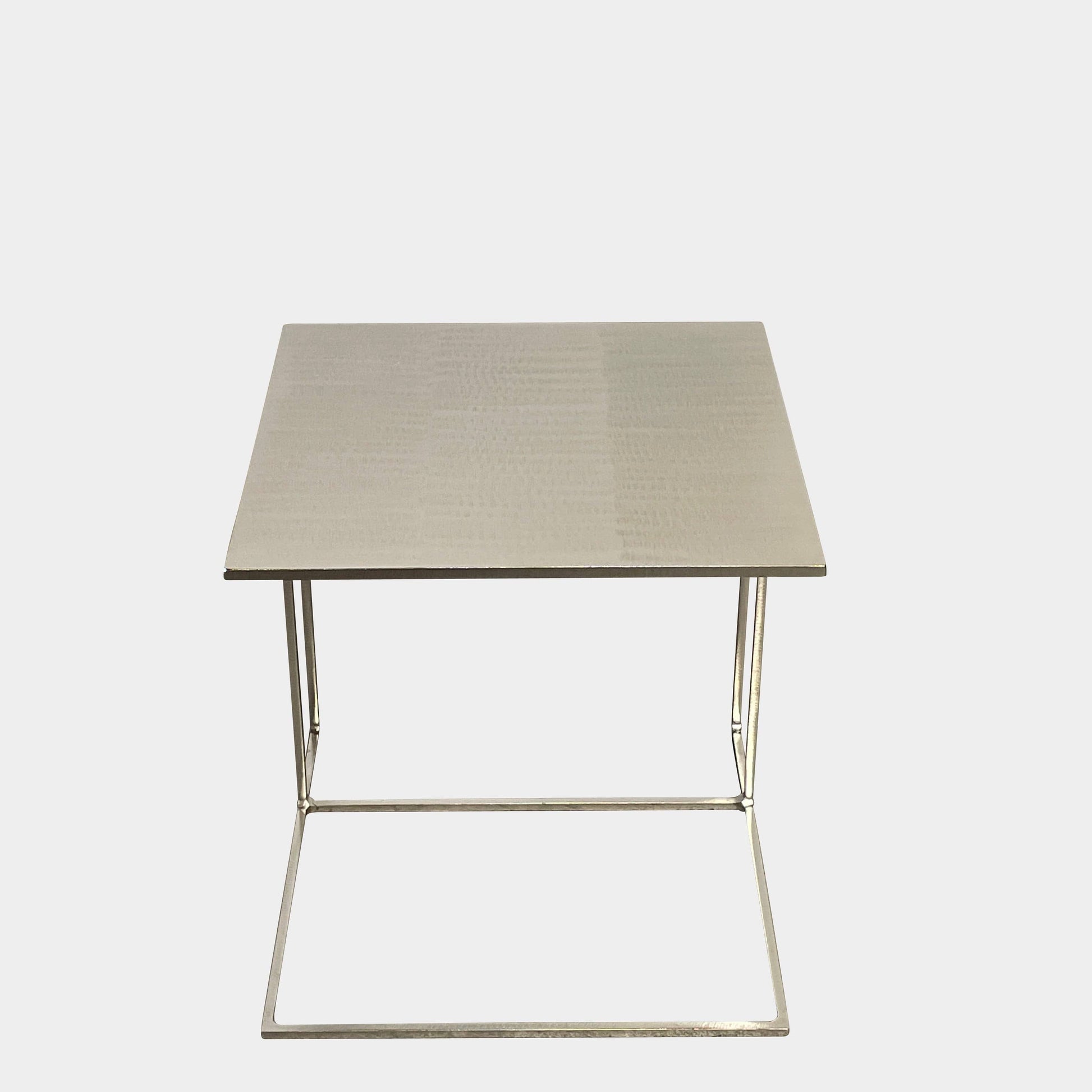 The Minotti Leger Side Table, by Minotti, features a metallic accent with its metal frame, creating a clean and minimal design against a white background.