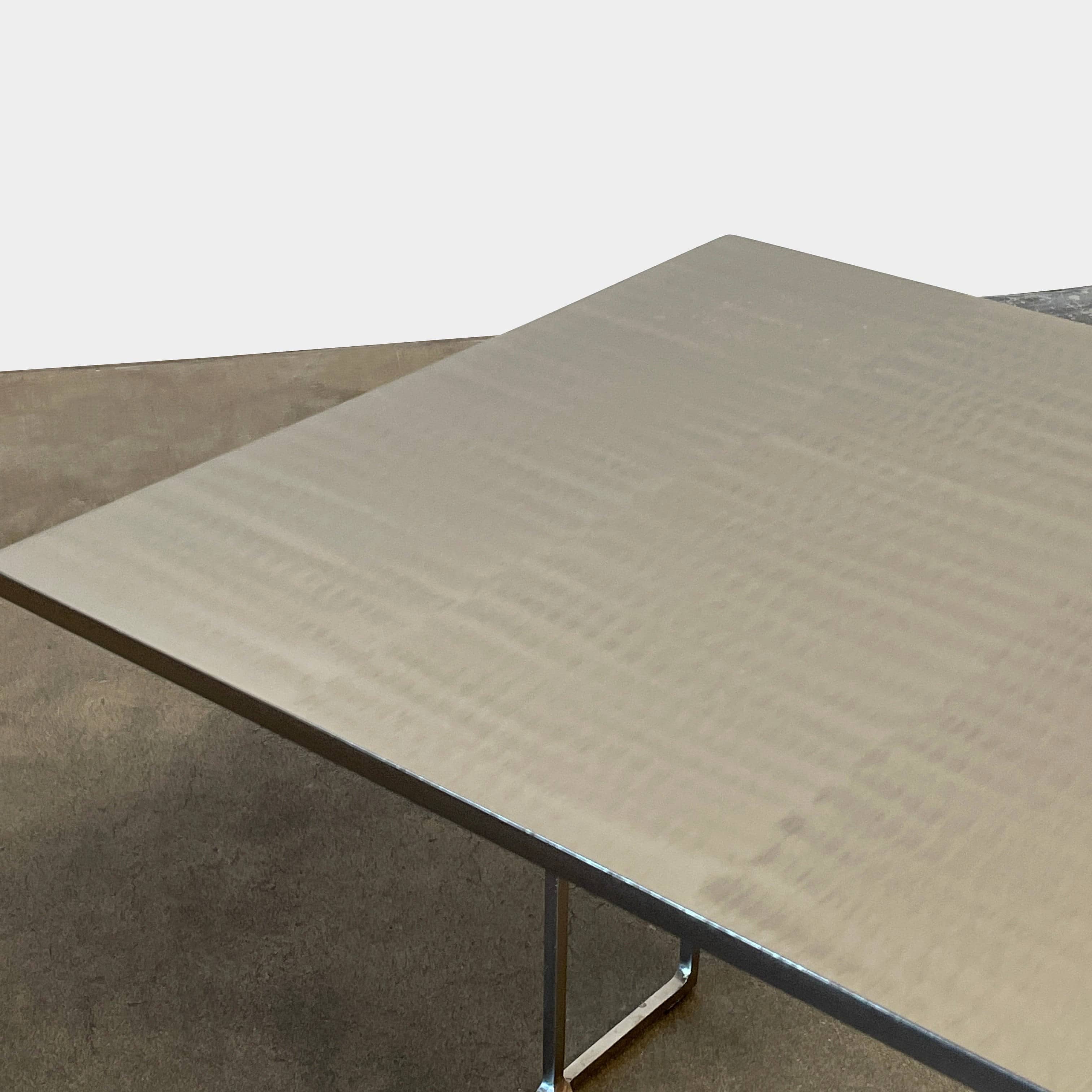 The Minotti Leger Side Table, by Minotti, features a metallic accent with its metal frame, creating a clean and minimal design against a white background.