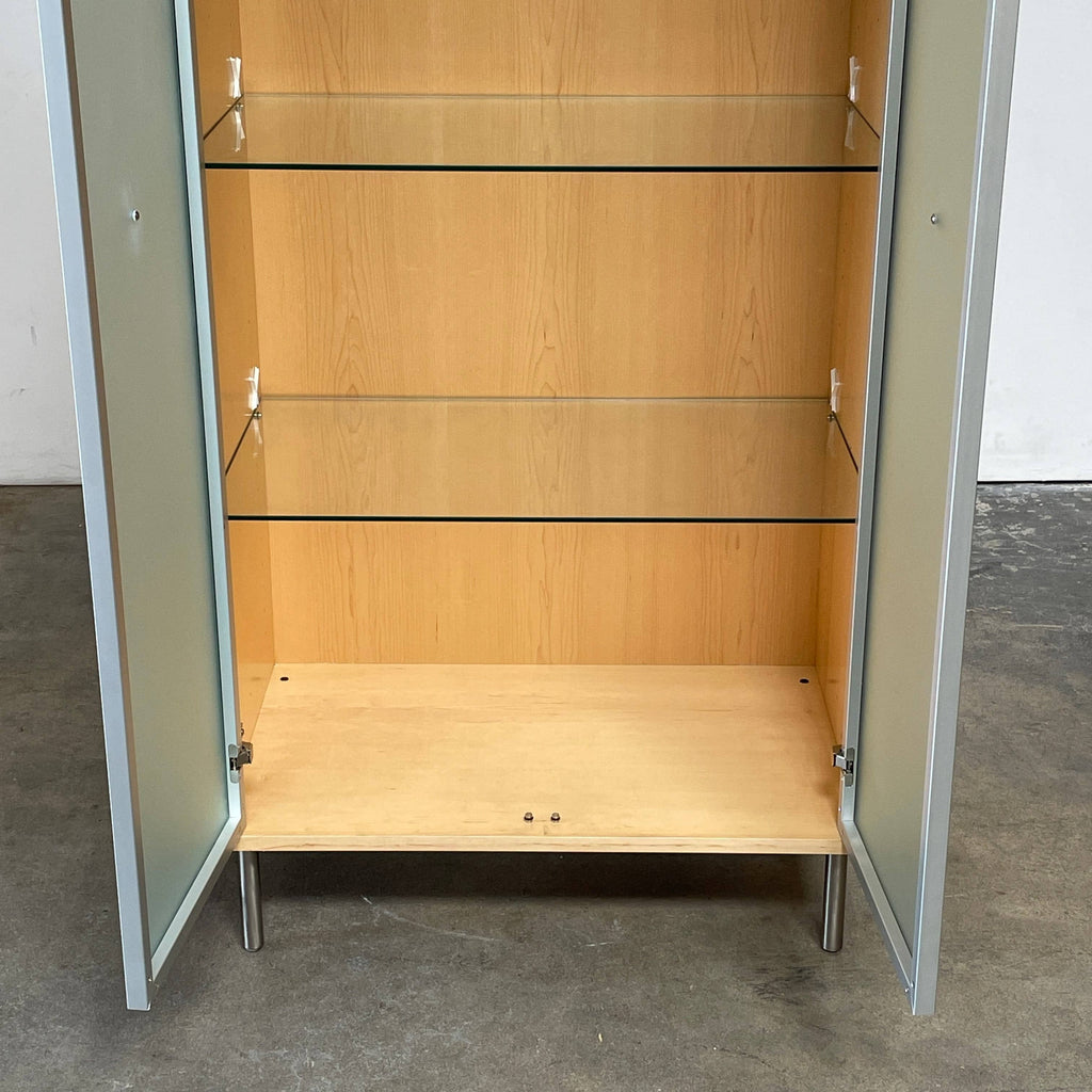 A Punt Mobles Cabinet with glass doors, wooden construction, and metal legs.