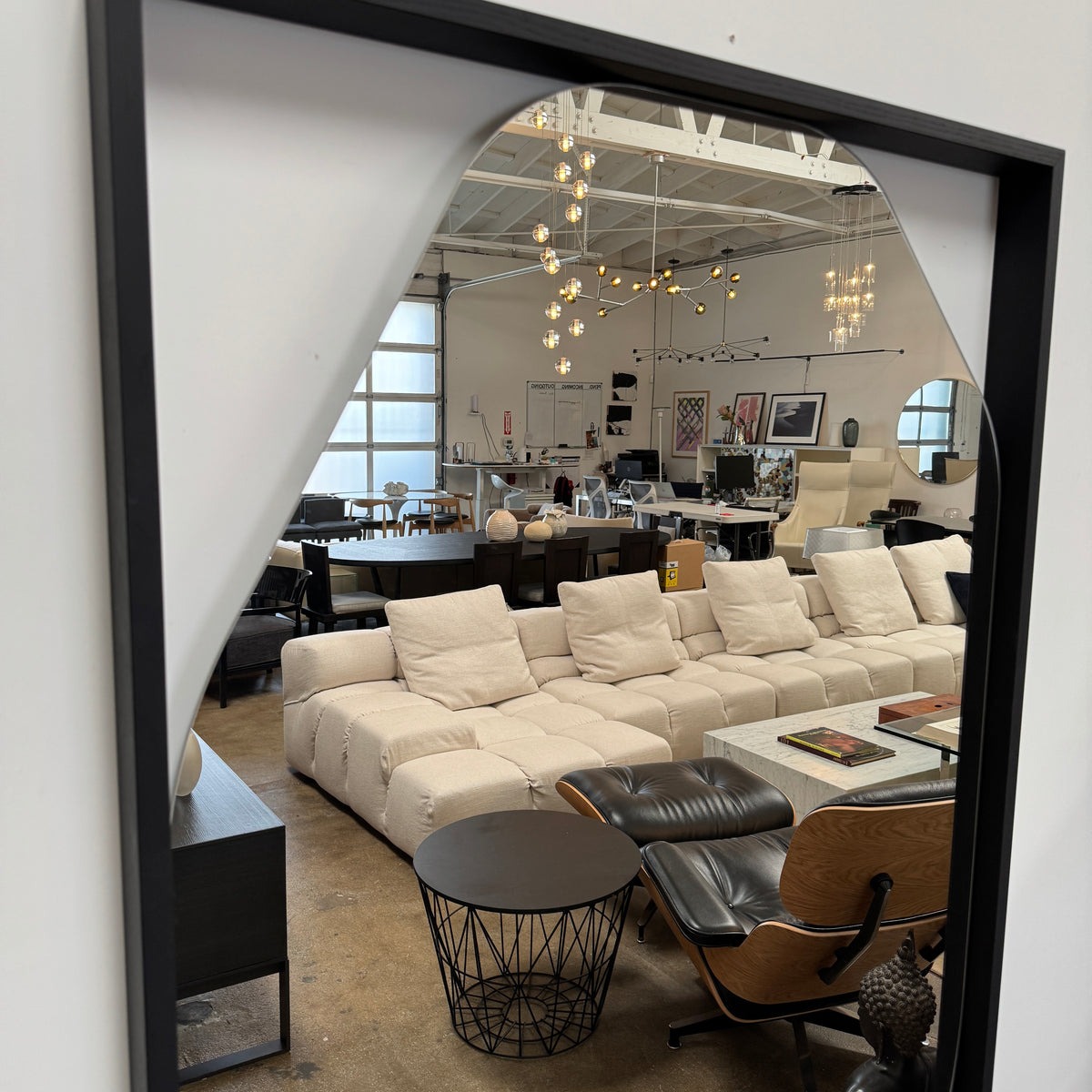 Rectangular wall mirror featuring a geometric, irregular octagonal silhouette set in a slim black metal frame against a minimalist backdrop—introducing the Ligne Roset Belize Mirror by Ligne Roset, an effortlessly modern statement piece for any space.