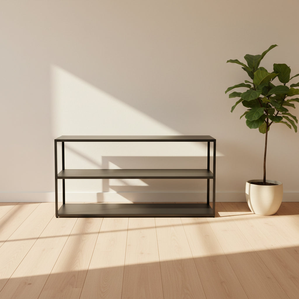 The Hay New Order System Shelves by Hay is a black, metal-framed, two-shelf open bookcase featuring a minimalist design inspired by Scandinavian aesthetics, shown against a plain white background.