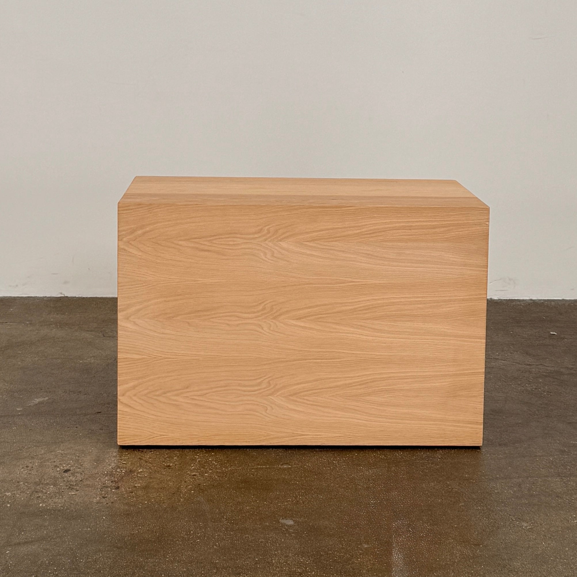 The Jenni Kayne Palms Nightstand Oak 30” by Jenni Kayne is a rectangular wooden drawer unit with a minimalist design, featuring one large lower drawer and one smaller upper drawer, showcased against a plain white background—a piece that perfectly captures the understated elegance of an oak nightstand, making it an ideal choice as a refined bedside table.