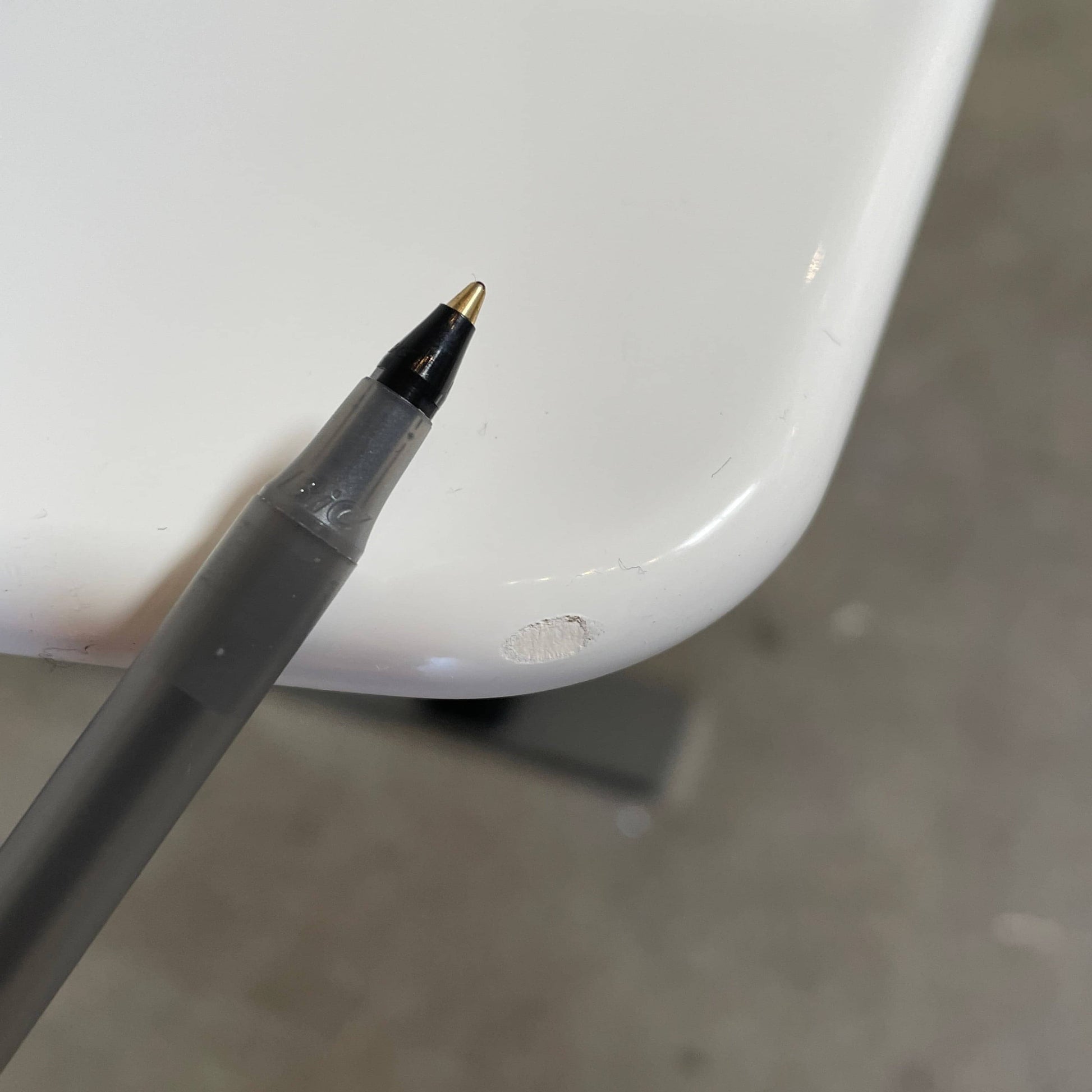 A minimalist rectangular B&B Italia Eileen White Dining Table featuring a sophisticated T-shaped metal base on a plain white background.