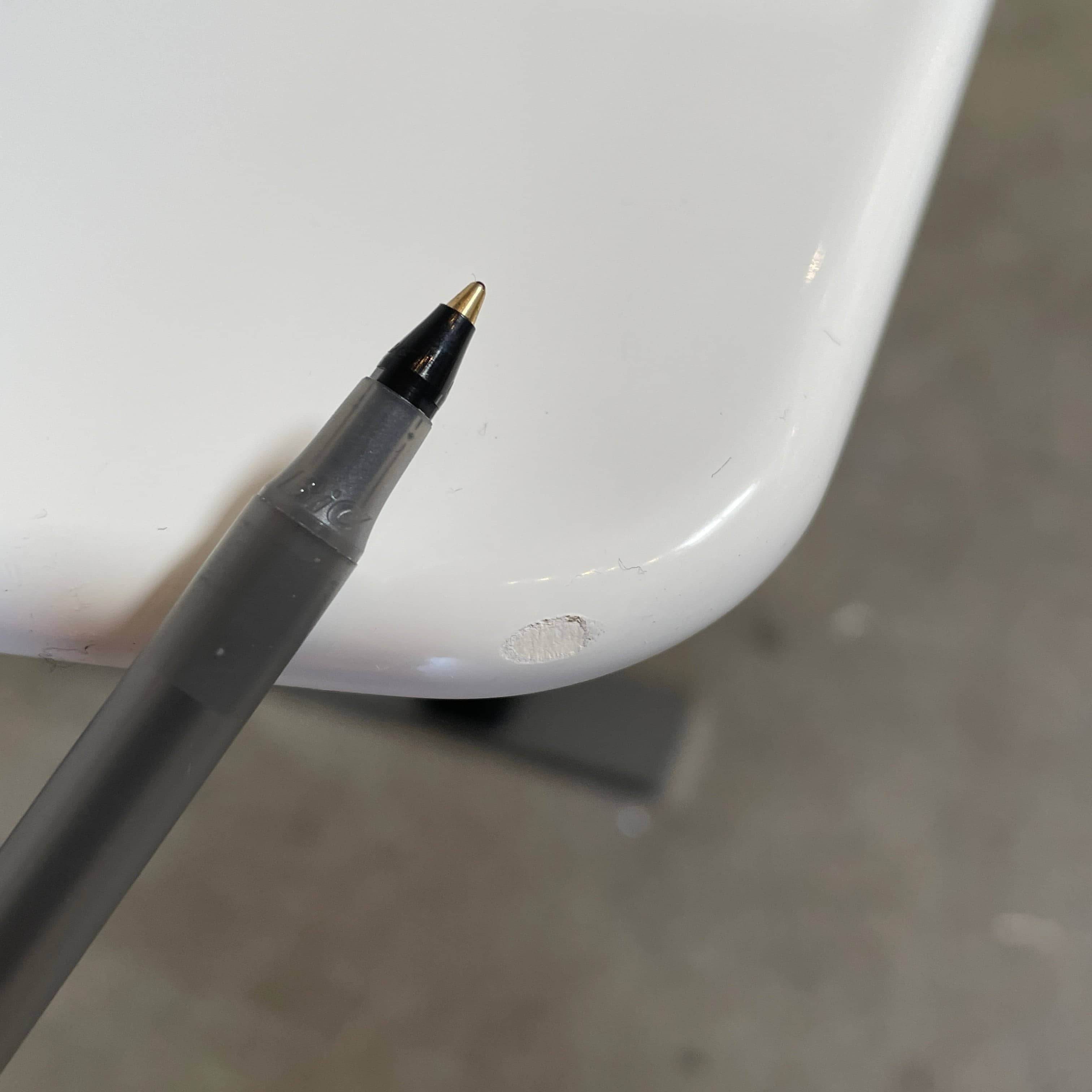 A minimalist rectangular B&B Italia Eileen White Dining Table featuring a sophisticated T-shaped metal base on a plain white background.