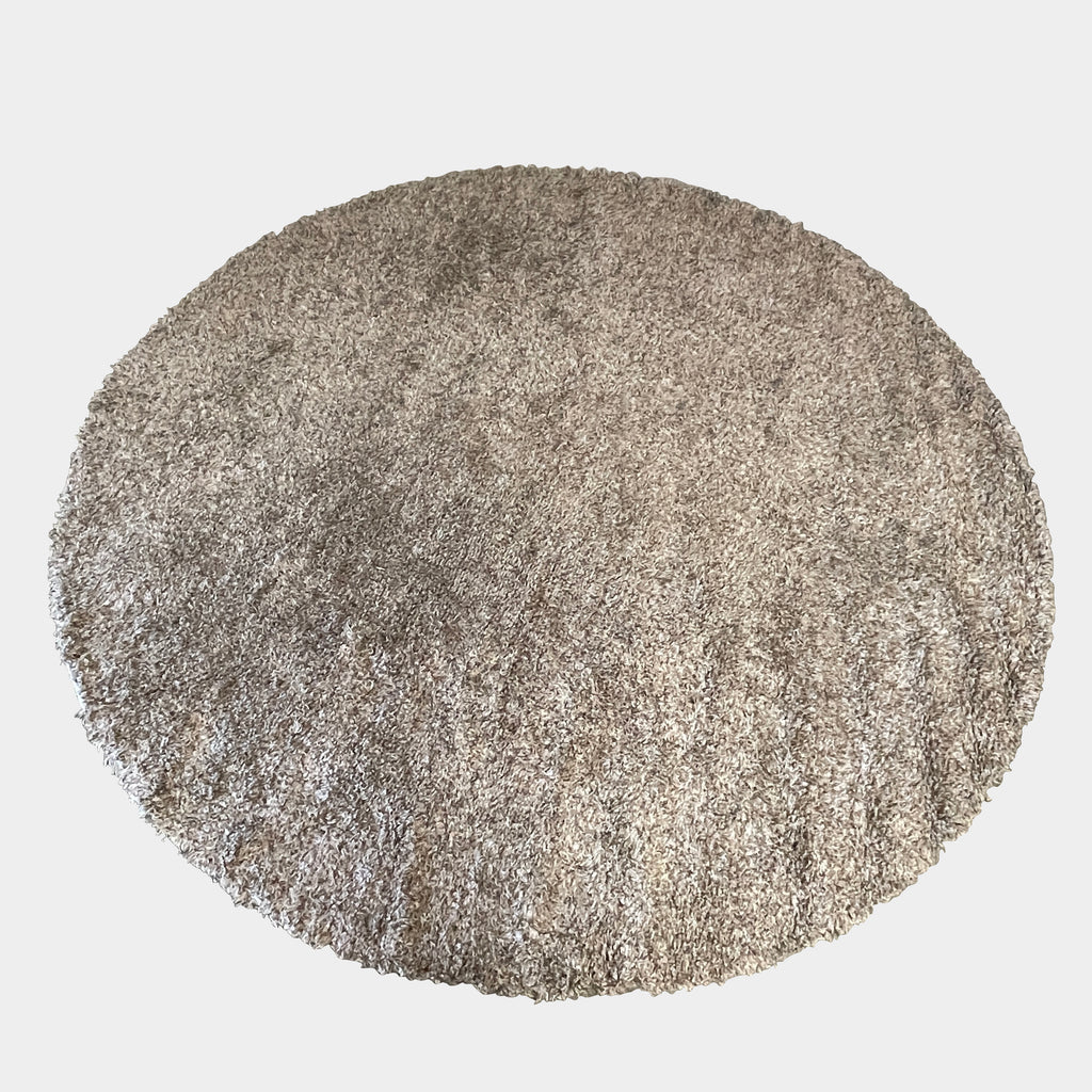 A Delinear Linen Neutral 10' Round Shag Rug on a white background, perfect for adding a touch of comfort and warmth to any space.