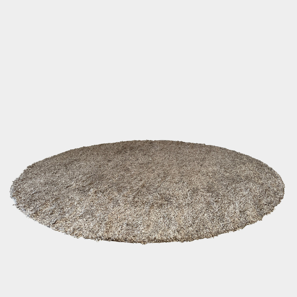 A Delinear Linen Neutral 10' Round Shag Rug on a white background, perfect for adding a touch of comfort and warmth to any space.