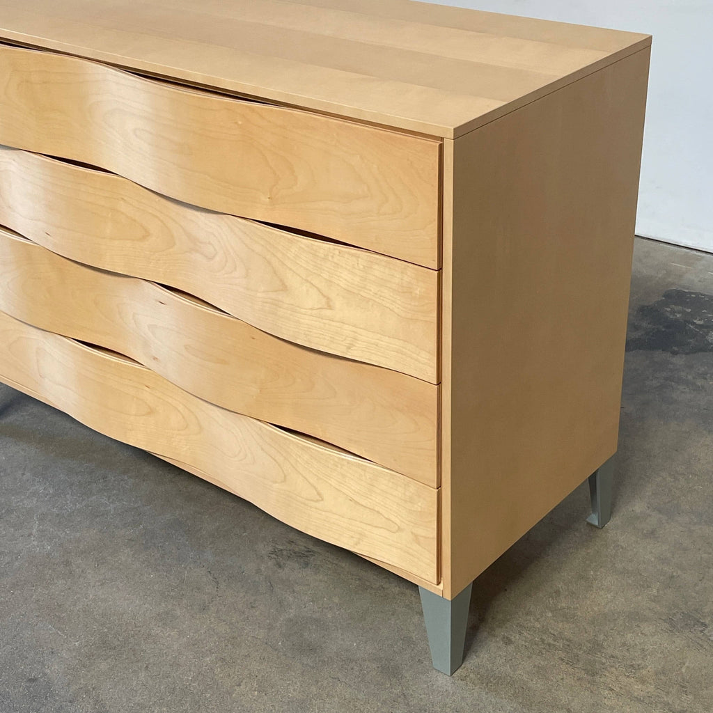 A wooden box labeled "Acerbis" was replaced with the "Acerbis Blonde Wavy Wood Dresser" from the brand Acerbis International.