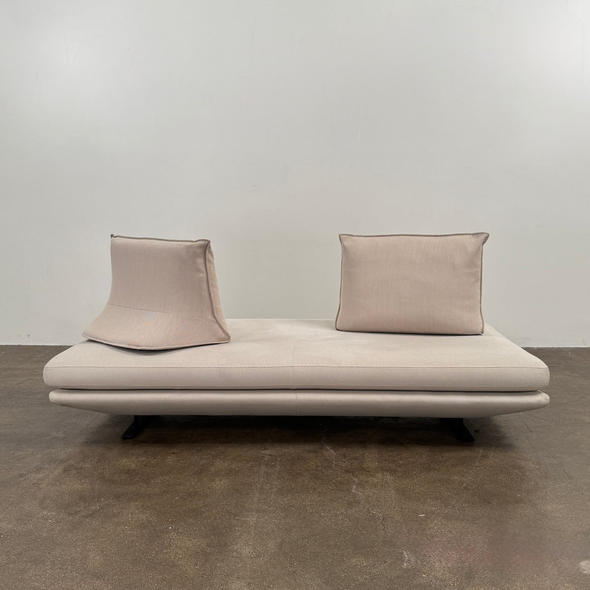 Ligne Roset Prado Sofa with 2 Backrests by Ligne Roset, featuring a beige modern design, two rectangular back cushions, and black angled legs, offering flexible seating options and set against a plain white background.