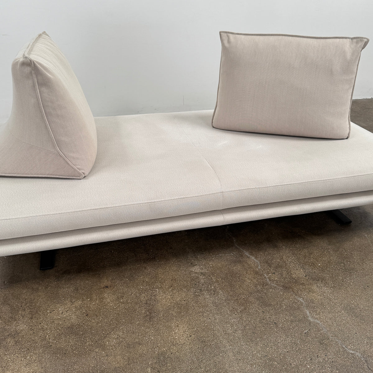 Ligne Roset Prado Sofa with 2 Backrests by Ligne Roset, featuring a beige modern design, two rectangular back cushions, and black angled legs, offering flexible seating options and set against a plain white background.