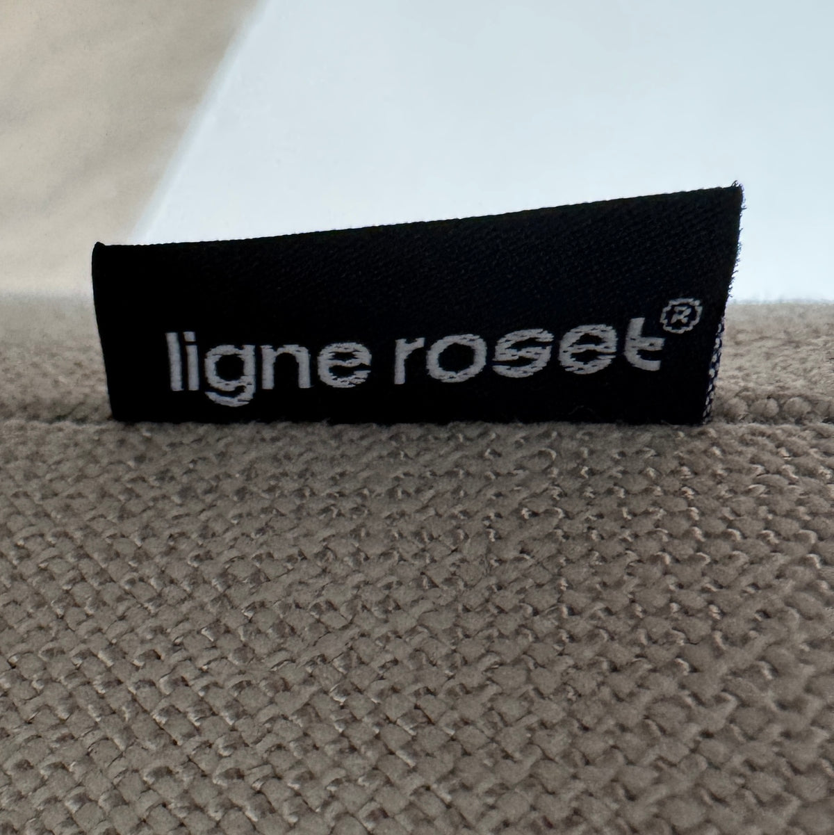 Ligne Roset Prado Sofa with 2 Backrests by Ligne Roset, featuring a beige modern design, two rectangular back cushions, and black angled legs, offering flexible seating options and set against a plain white background.