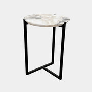The Baxter Icaro Polar White Marble Accent Table - Small by Baxter showcases a sleek black metal base and a smooth Polar White marble top, photographed against a plain white background.