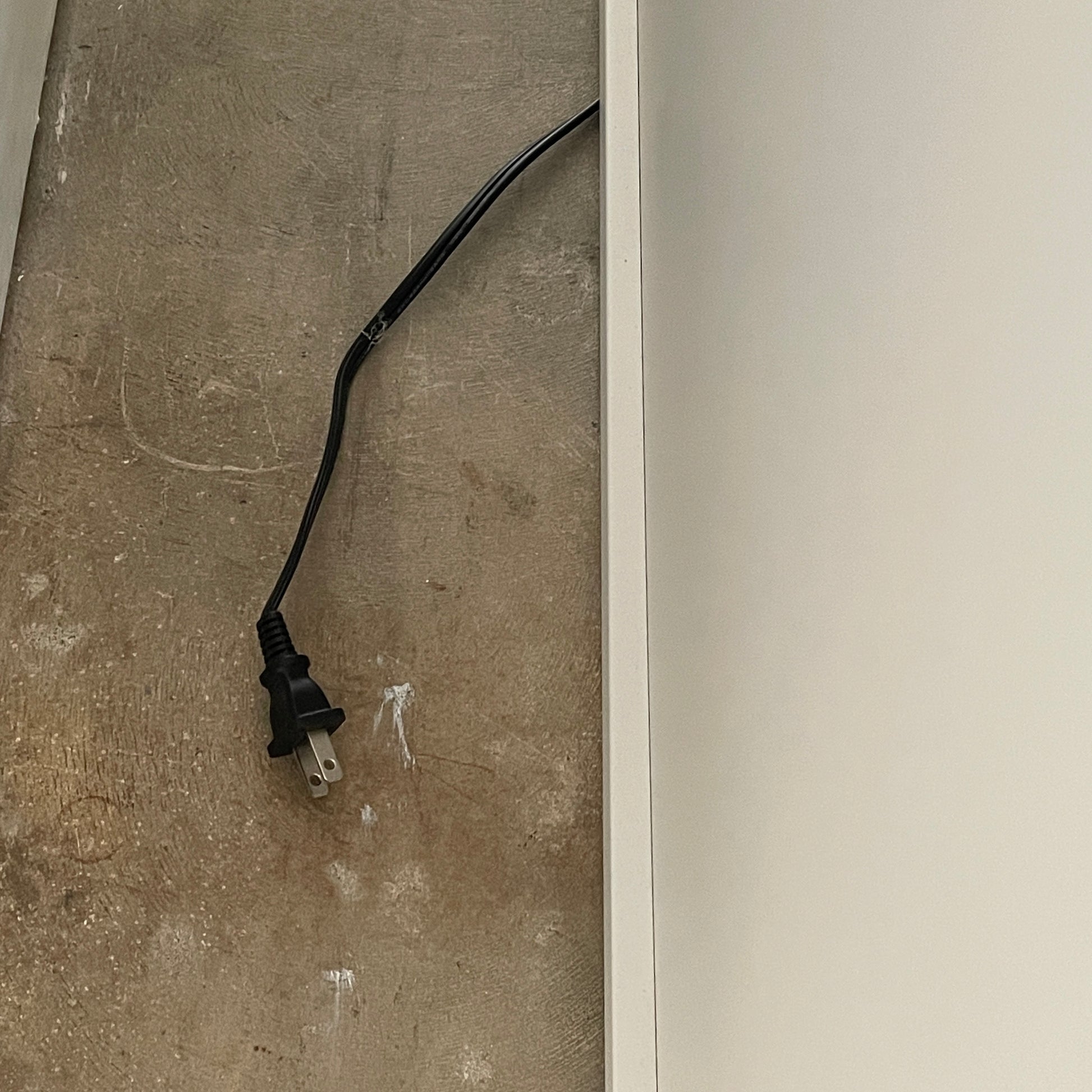 The Roche Bobois Denia Bookcase is a white bookshelf characterized by its abstract design, featuring multiple irregular oval cutouts, nine internal compartments, and integrated LED lighting, reminiscent of ROCHE BOBOIS styling.