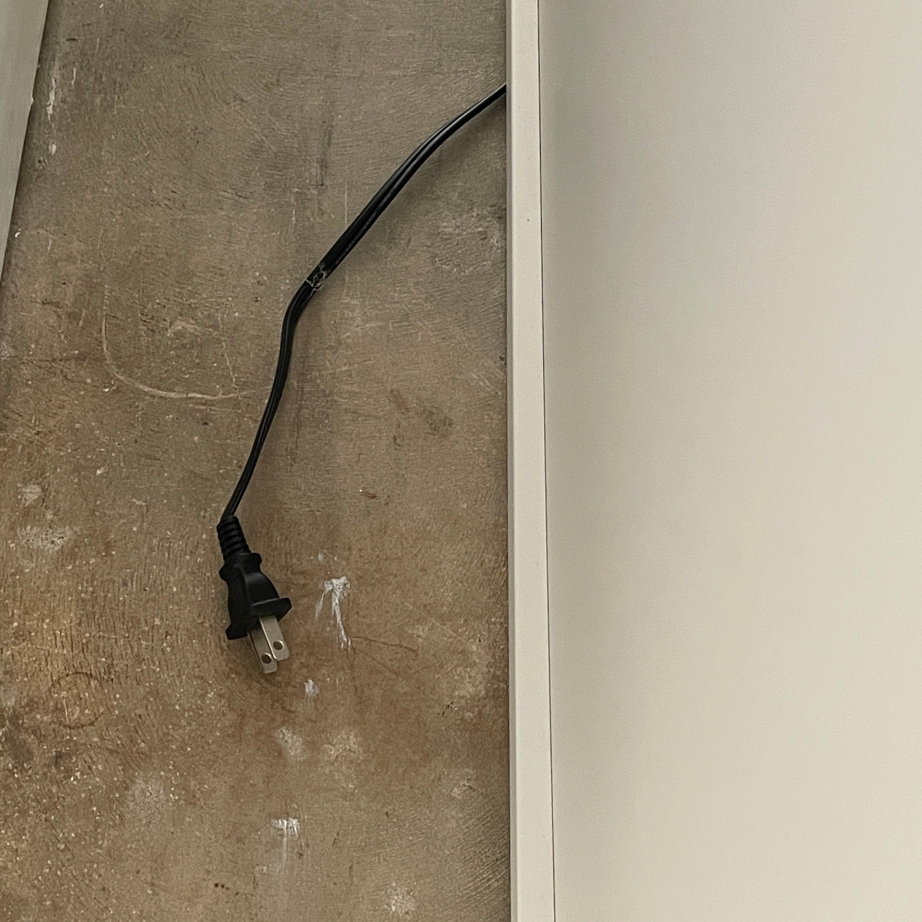 The Roche Bobois Denia Bookcase is a white bookshelf characterized by its abstract design, featuring multiple irregular oval cutouts, nine internal compartments, and integrated LED lighting, reminiscent of ROCHE BOBOIS styling.