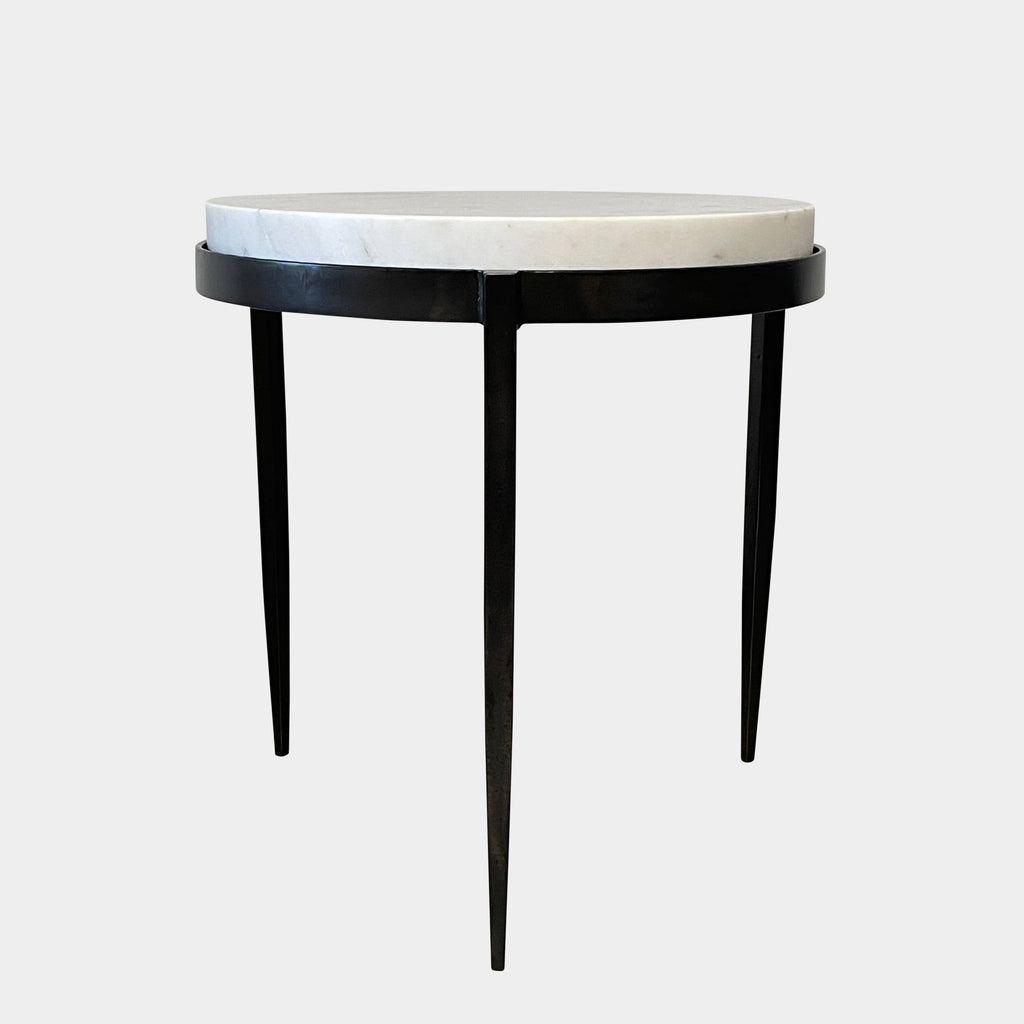 An Arteriors Kelsie Table with a marble top.