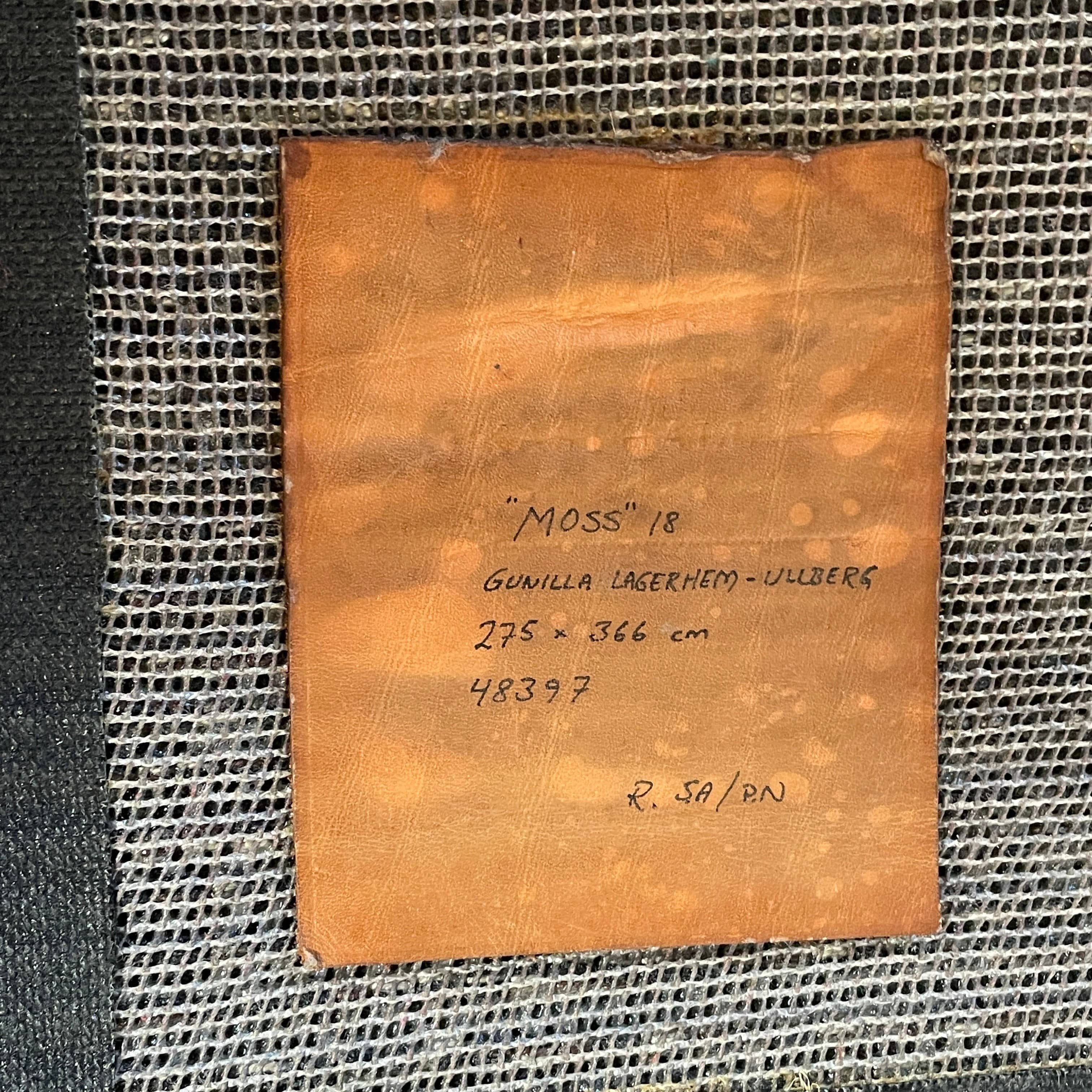 The Kasthall Moss Rug, designed by Gunnila Lagerhem Ullberg, is a hand-tufted rug featuring a shaggy black texture on a crisp white background.