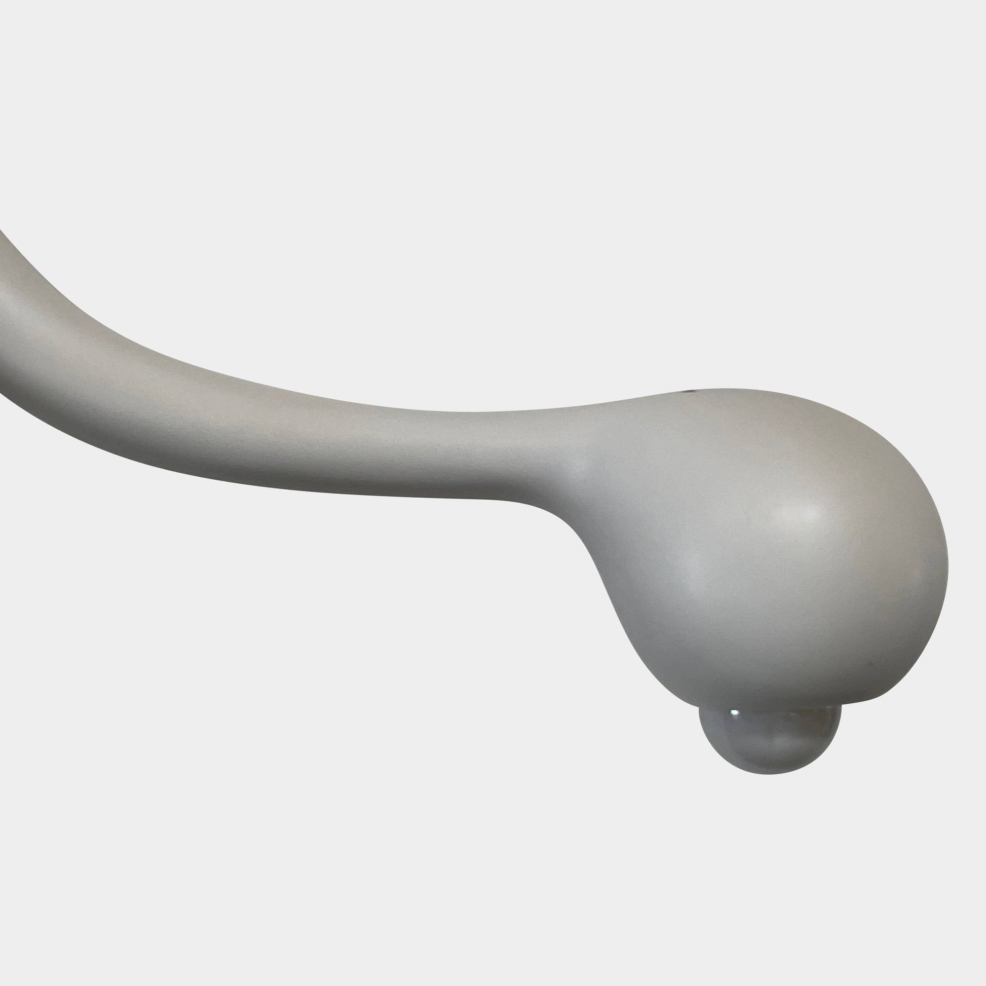 A white, three-legged stand with rounded feet and a flat top against a plain background, reminiscent of the elegant aesthetic found in Entler Studio's 3-Globe Ceiling Light creations.