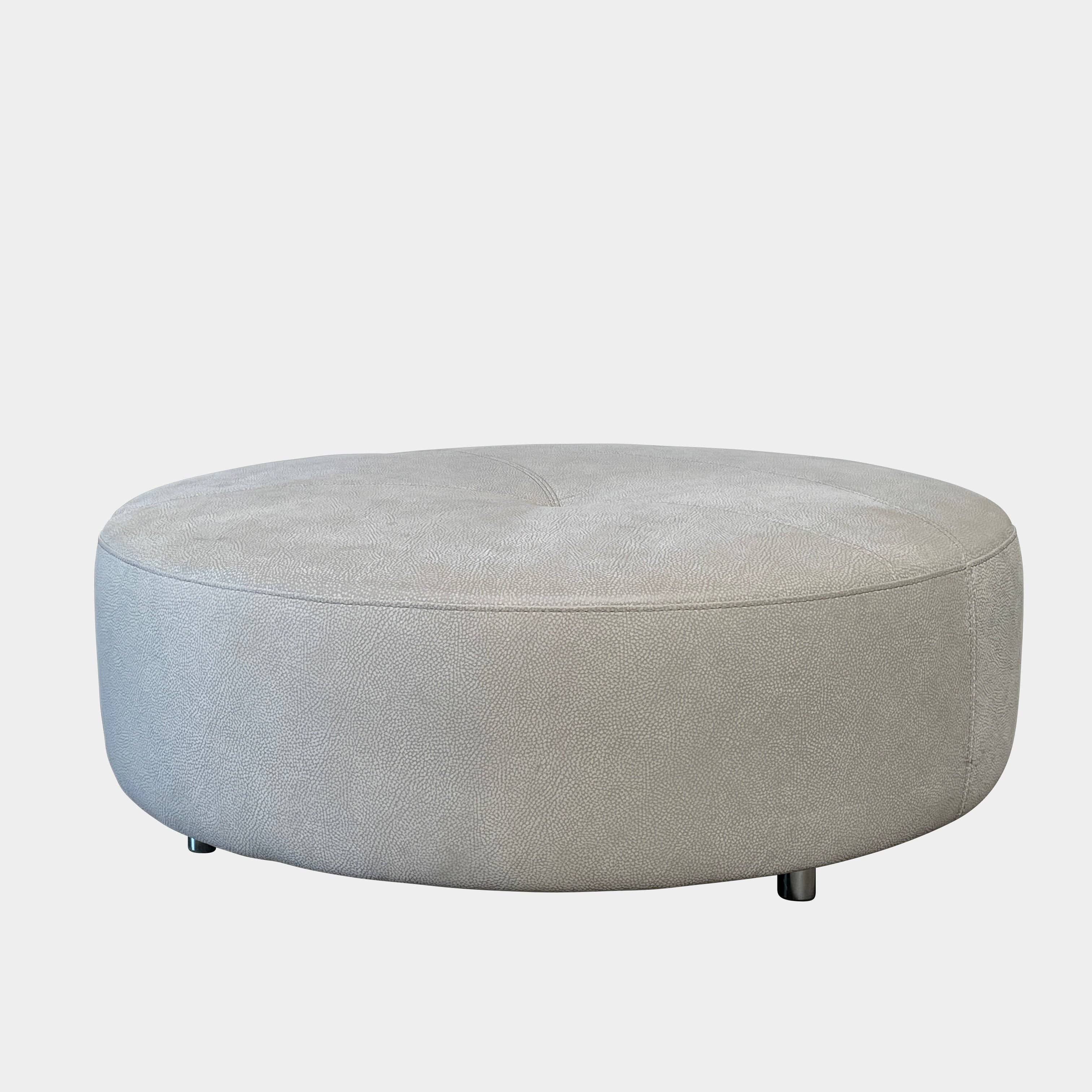 A Roche Bobois Digital Sofa and Ottoman, featuring a curved grey sectional design with three cushions and an additional round ottoman, set against a plain white background.