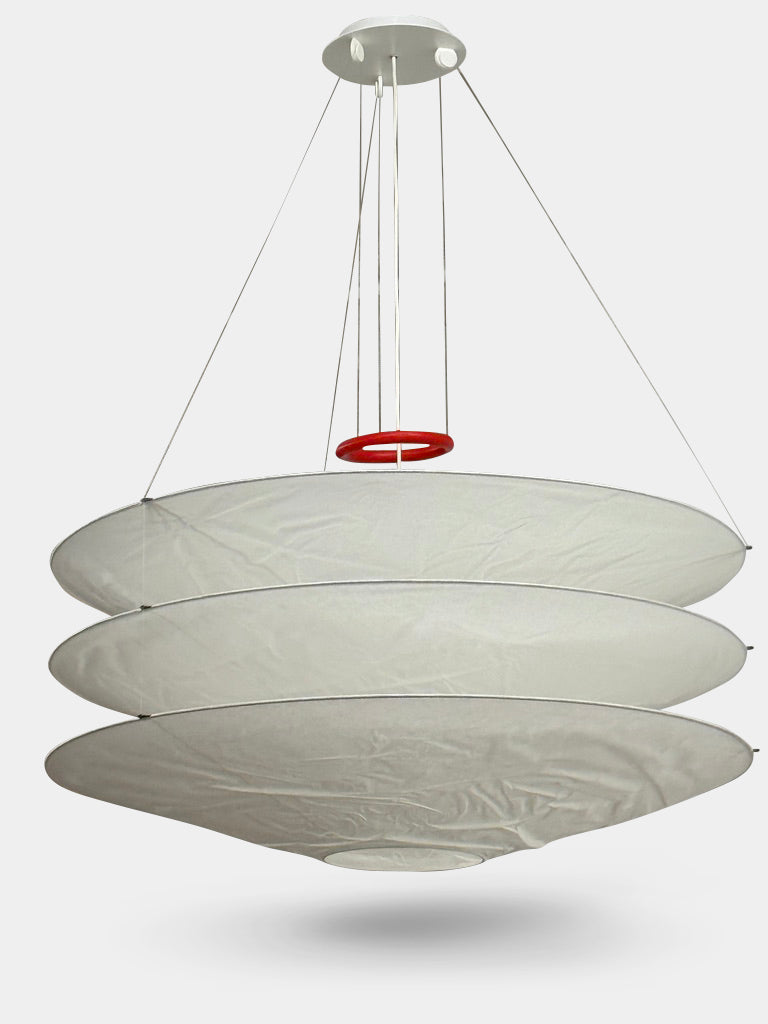 The Ingo Maurer Floatation Suspension Light Medium Size is a modern chandelier with a red ring accent and three overlapping circular discs, showcasing Ingo Maurer's artistry with its elegant and innovative design, suspended elegantly by wires.