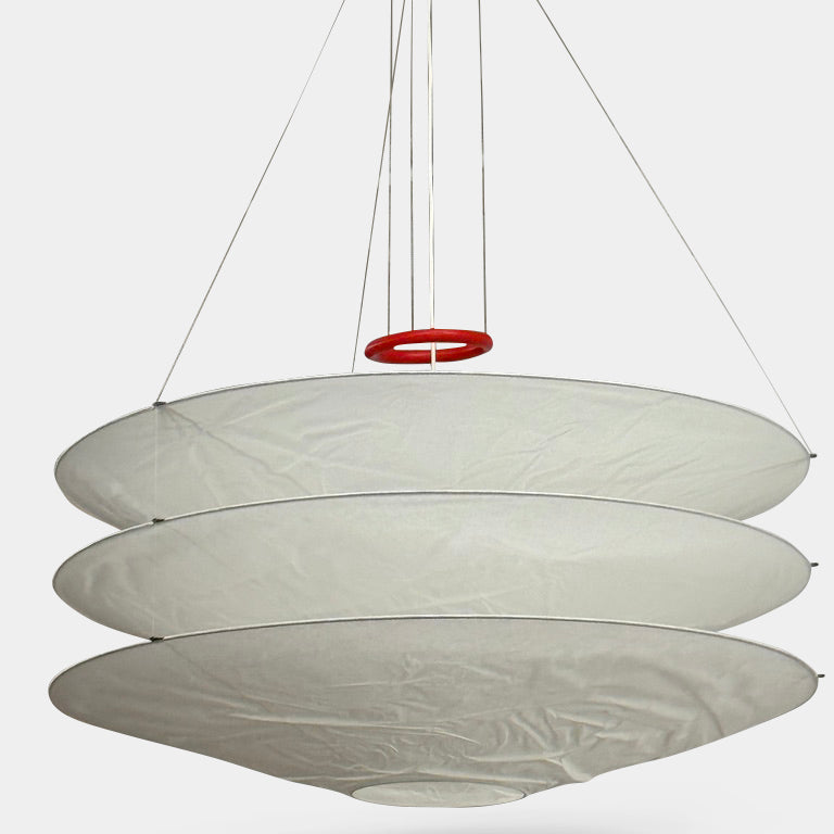 The Ingo Maurer Floatation Suspension Light Medium Size is a modern chandelier with a red ring accent and three overlapping circular discs, showcasing Ingo Maurer's artistry with its elegant and innovative design, suspended elegantly by wires.