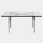 The Vintage DWR Barcelona Coffee Table by DWR features a rectangular glass top, four metal legs, and a visible metal support frame underneath.