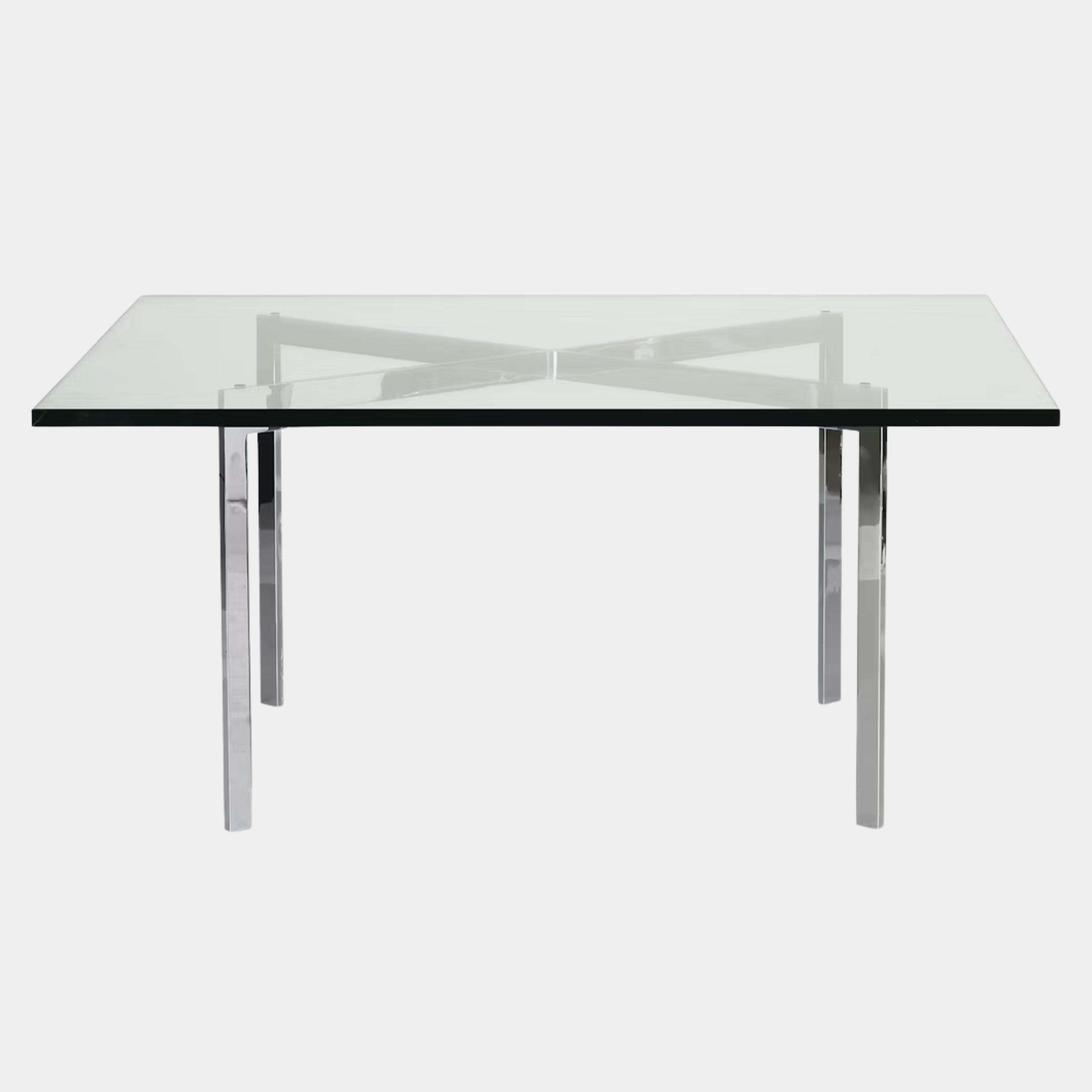 The Vintage DWR Barcelona Coffee Table by DWR features a rectangular glass top, four metal legs, and a visible metal support frame underneath.