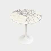 Round Knoll Saarinen Arabescato Marble Top Side Table with a single pedestal base.
