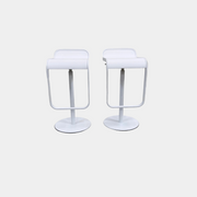 Two white LEM Piston Stools by La Palma featuring pedestal bases and rectangular footrests.