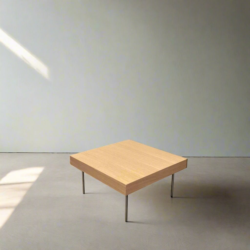 Ligne Roset Natural Wood Needle Table with metal legs on a plain white background, showcasing an elegant natural design.