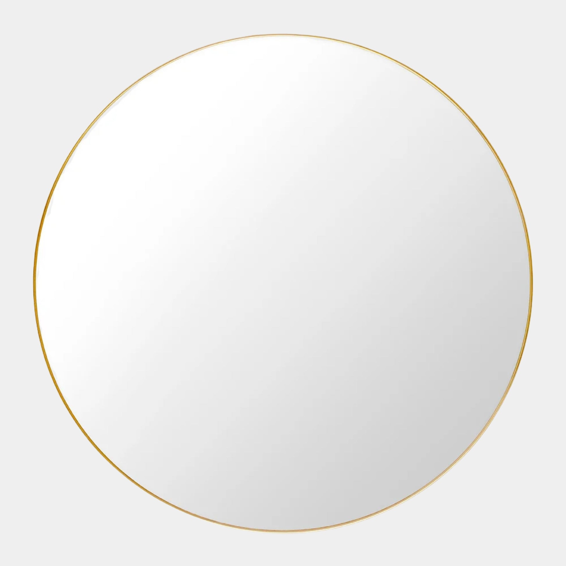 The Gubi 43″ Round Wall Mirror in Polished Brass, by Gubi, is displayed against a plain light gray background, showcasing its sleek and timeless design inspired by the iconic Gubi wall mirror.
